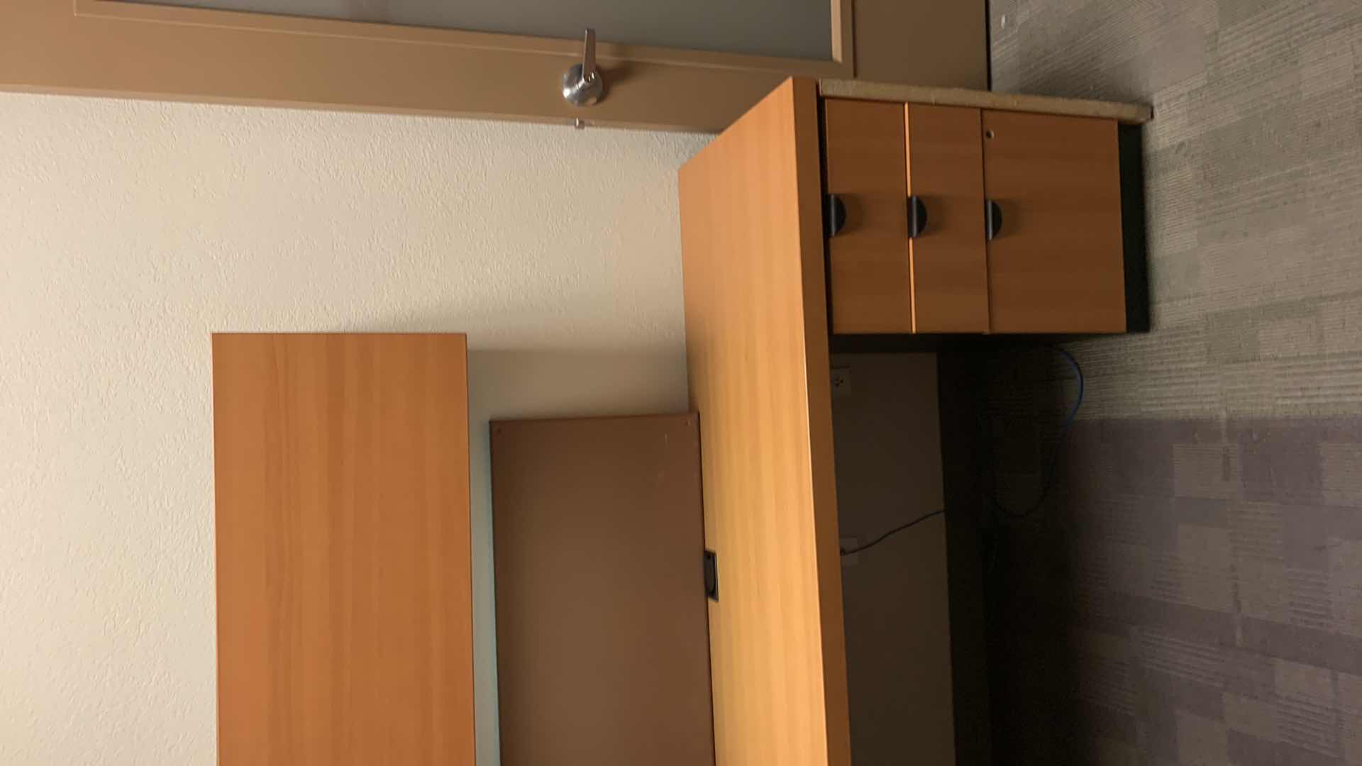 Photo 1 of MAGNA DESIGN LAS VEGAS WOOD WORK STATION/ OFFICE CORNER DESK UNIT 
ONE LOWER DESK  72” x 24” WITH RETURN 52” x 24”, ONE SOUND BOARD AND TWO UPPER CABINETS WITH LIGHTS AND METAL DIVIDERS