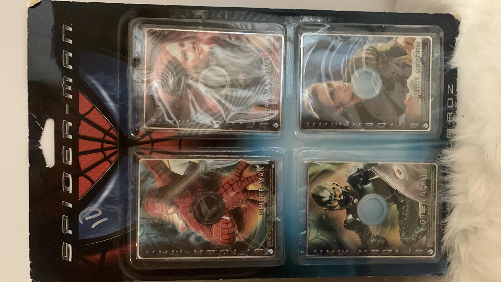 Photo 1 of SPIDER-MAN COLLECTIBLES, 4 PACK OF CARDS AND HARDCOVER BOOK