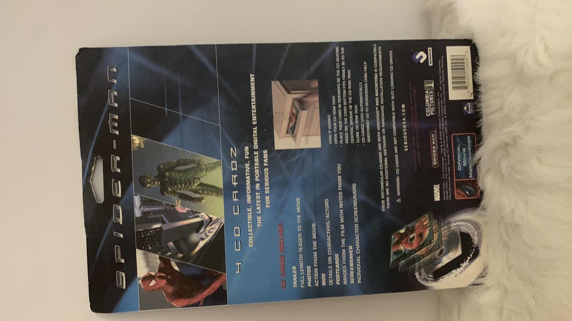 Photo 1 of SPIDER-MAN COLLECTIBLES, 4 PACK OF CARDS AND HARDCOVER BOOK