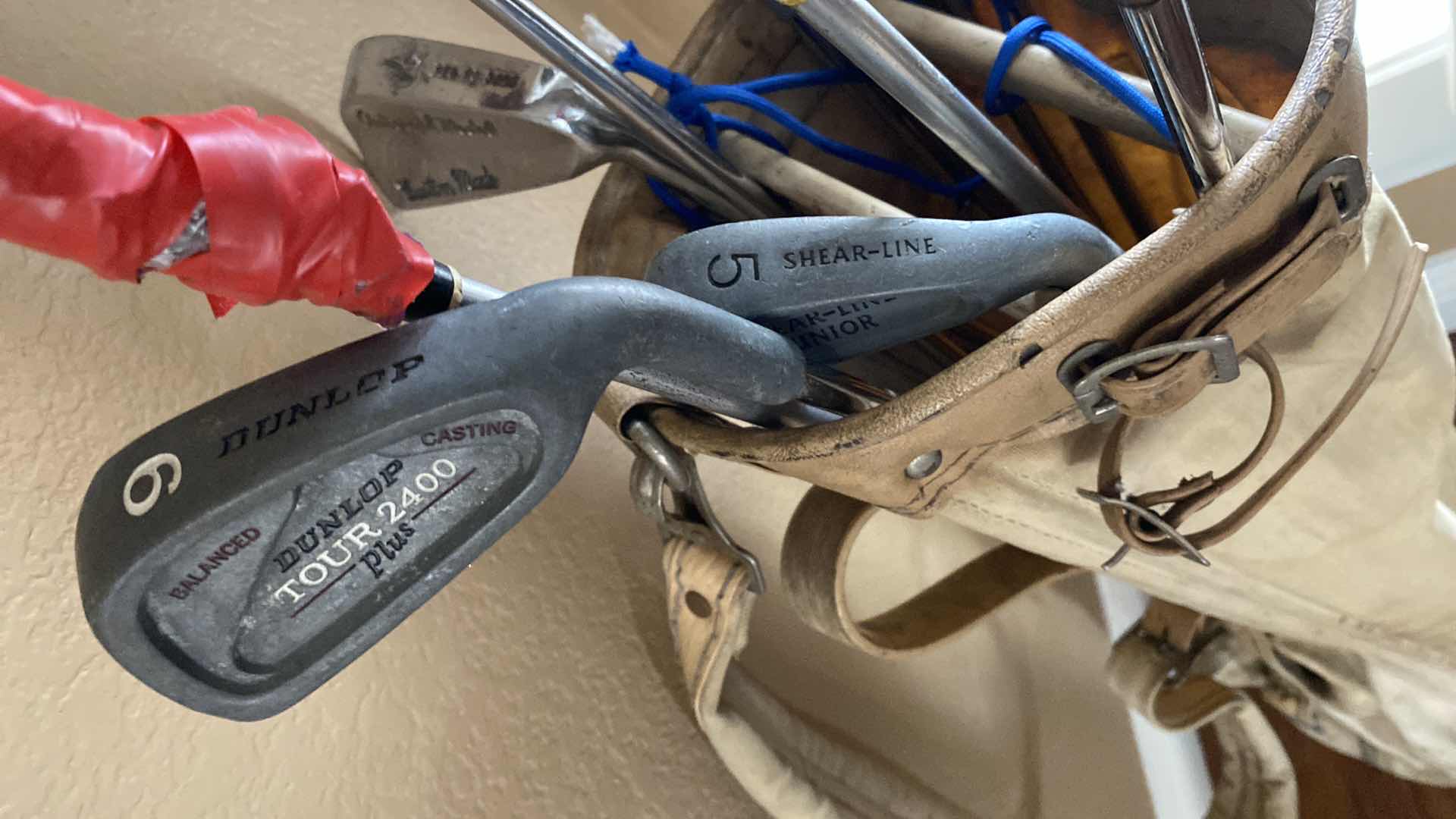 Photo 1 of GOLF BAG WITH ASSORTED CLUBS COUGAR DUNLOP AND MORE