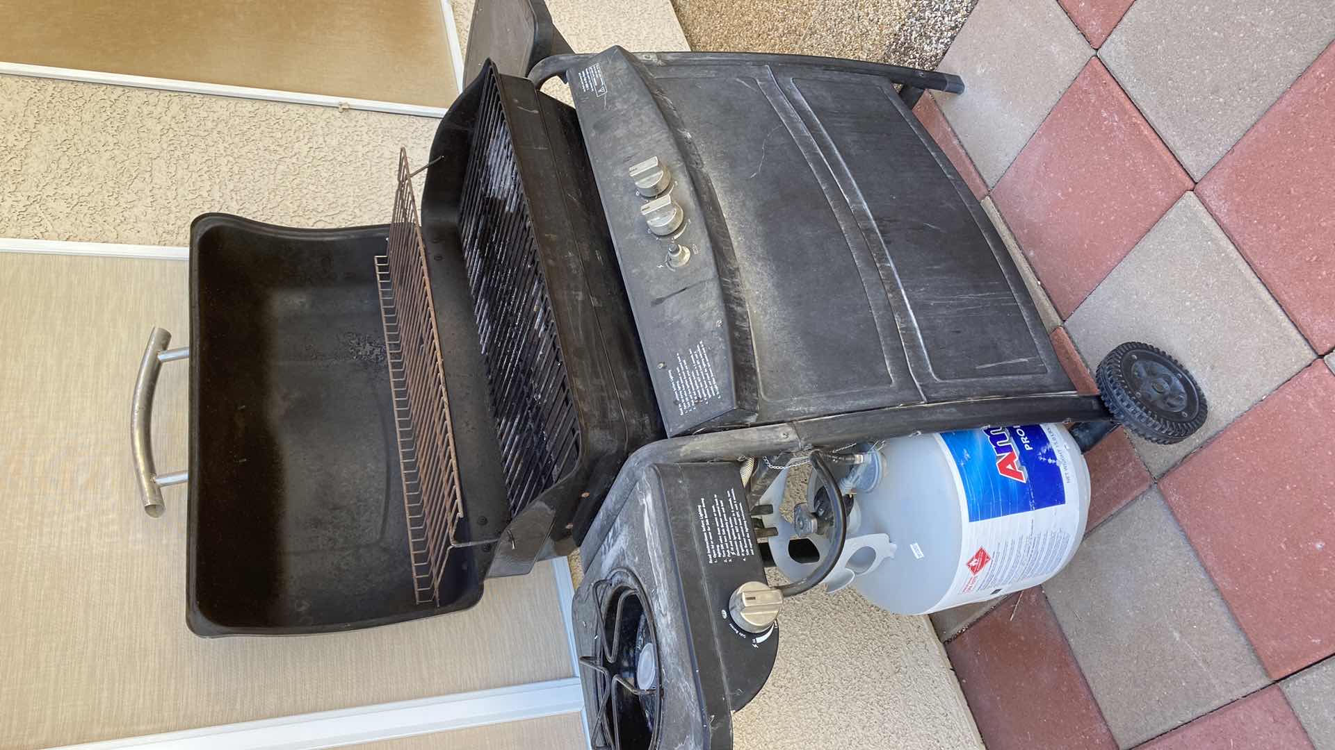 Photo 1 of KENMORE BARBECUE WITH PROPANE TANK AND BURNER ON SIDE, GRILL AREA 28” X 14” COVER INCLUDED