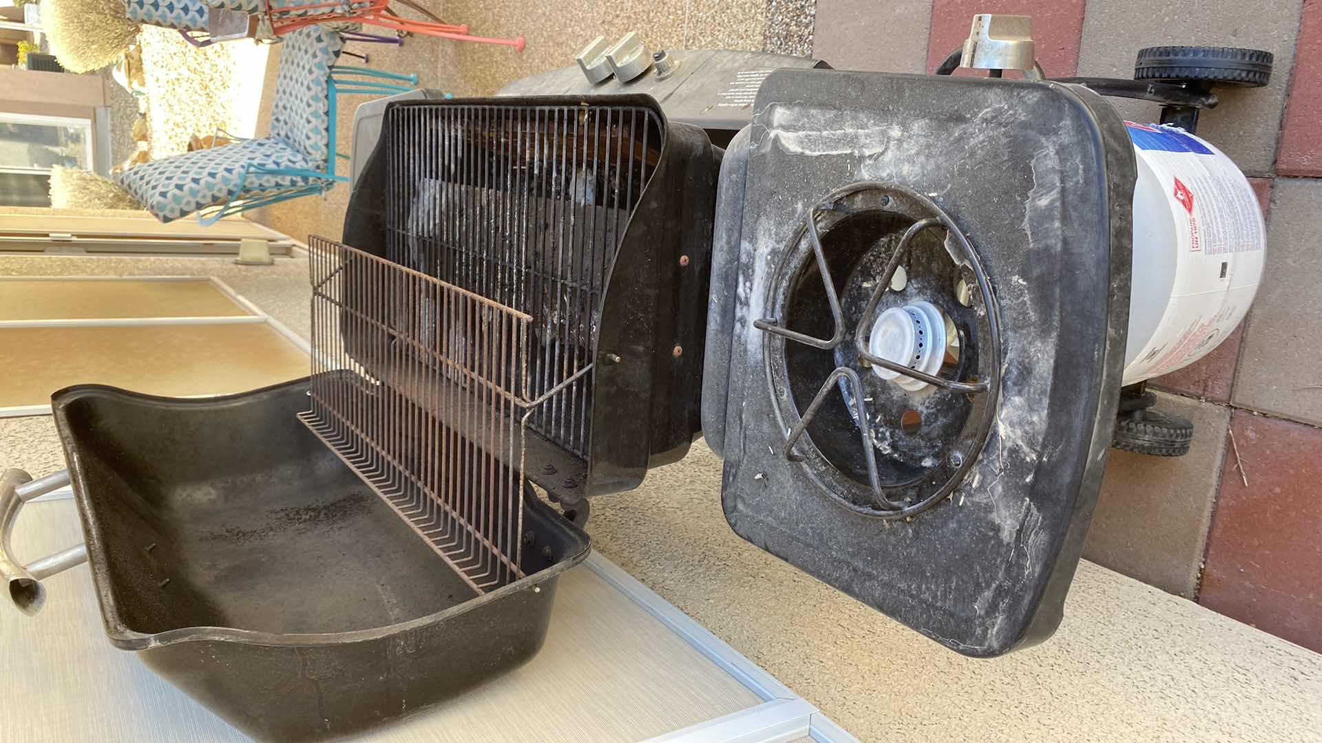 Photo 1 of KENMORE BARBECUE WITH PROPANE TANK AND BURNER ON SIDE, GRILL AREA 28” X 14” COVER INCLUDED