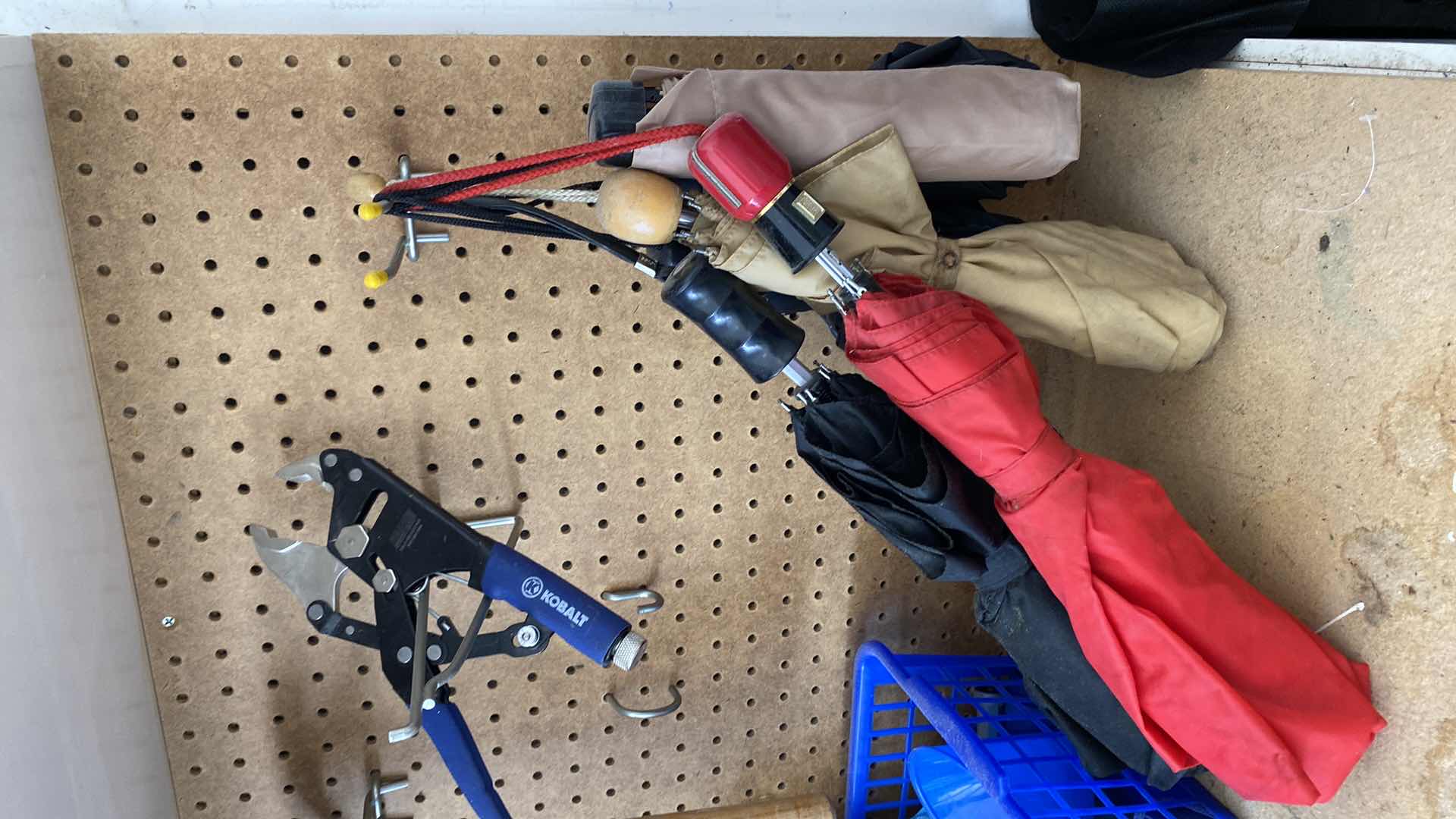 Photo 1 of TOP OF COUNTER AND ITEMS ON PEG BOARD IN GARAGE