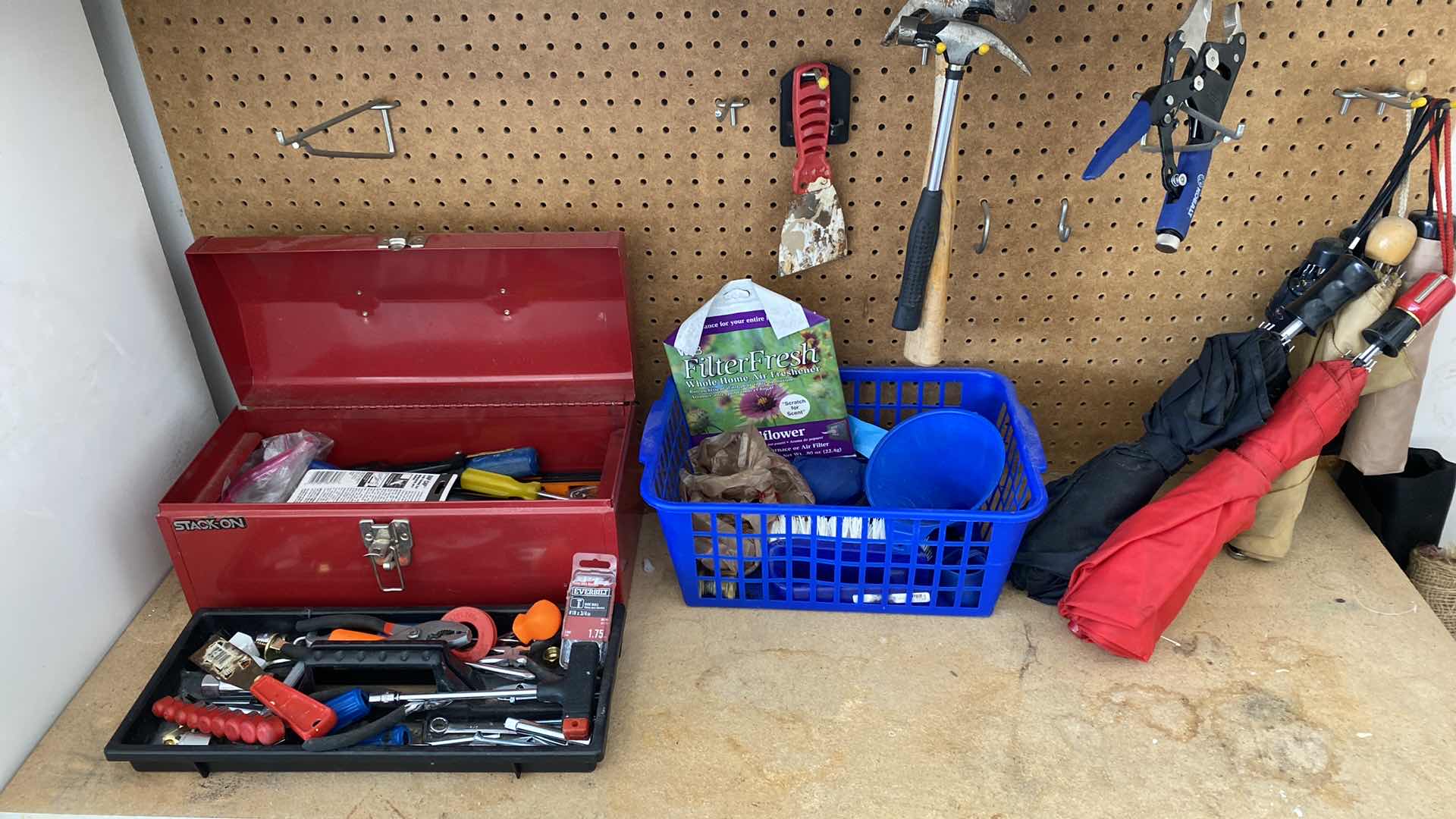 Photo 1 of TOP OF COUNTER AND ITEMS ON PEG BOARD IN GARAGE