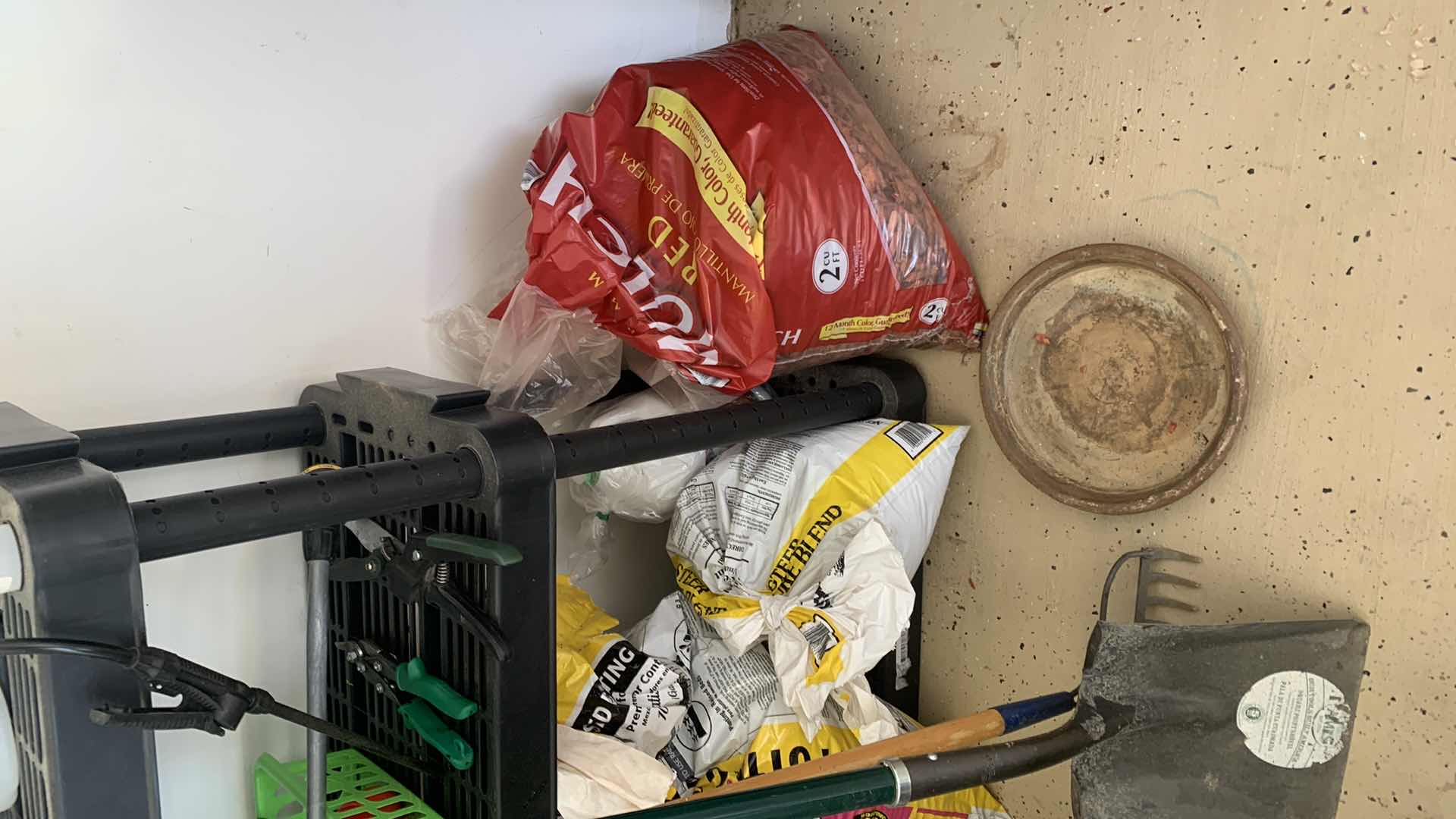 Photo 1 of BLACK SHELF UNIT AND GARDENING SUPPLIES