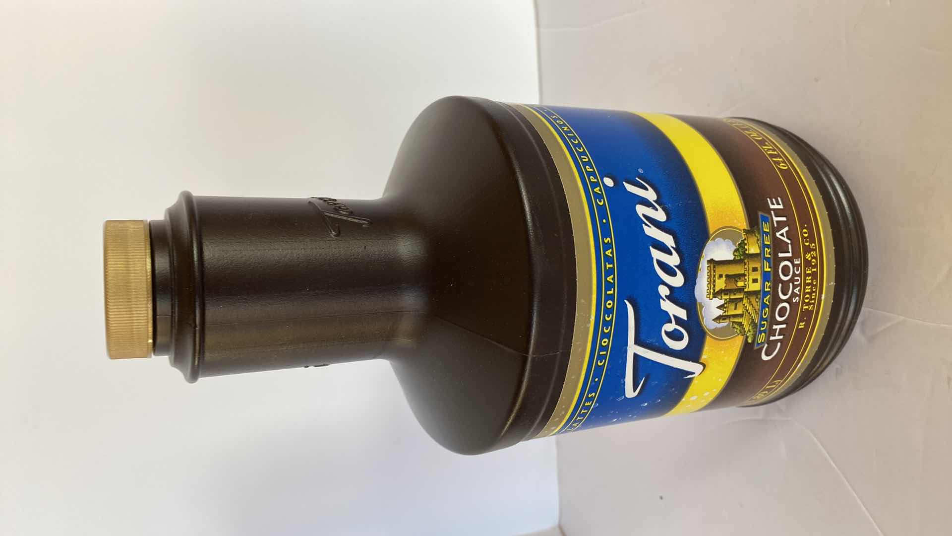 Photo 1 of TORANI CHOCOLATE SAUCE AND 4 SYRUPS UNKNOWN EXPIRATION DATES, INCLUDES TOTE