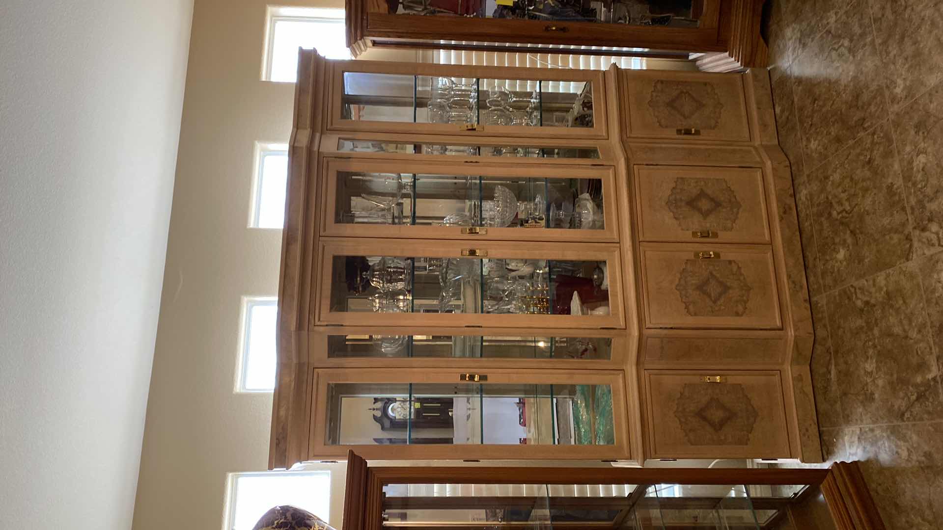 View 1 of BLONDE WOOD CHINA DISPLAY WITH 4 DOORS, 3 DRAWERS AND LIGHTS 68" X 18" H83" (CONTENTS NOT INCLUDED)