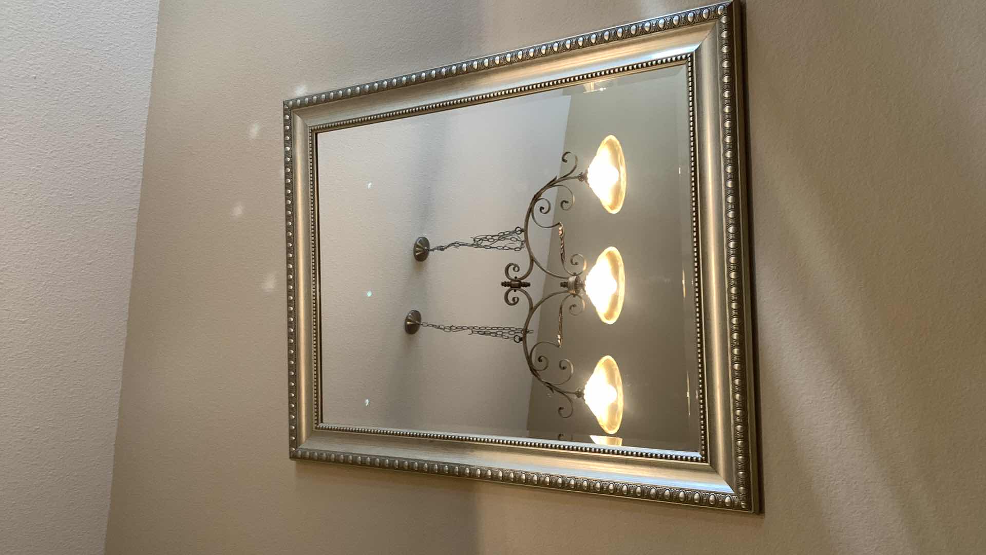 Photo 1 of BEVELED GLASS SILVER FRAMED MIRROR 38” x 46”