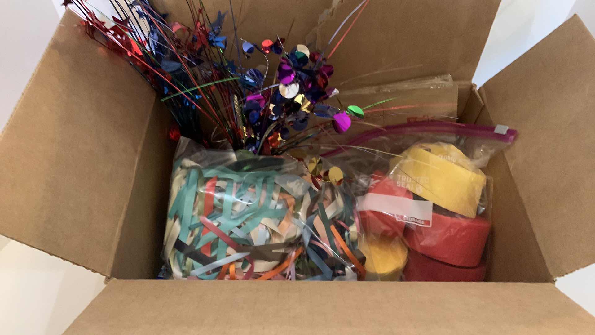 Photo 1 of BOX OF PARTY SUPPLIES