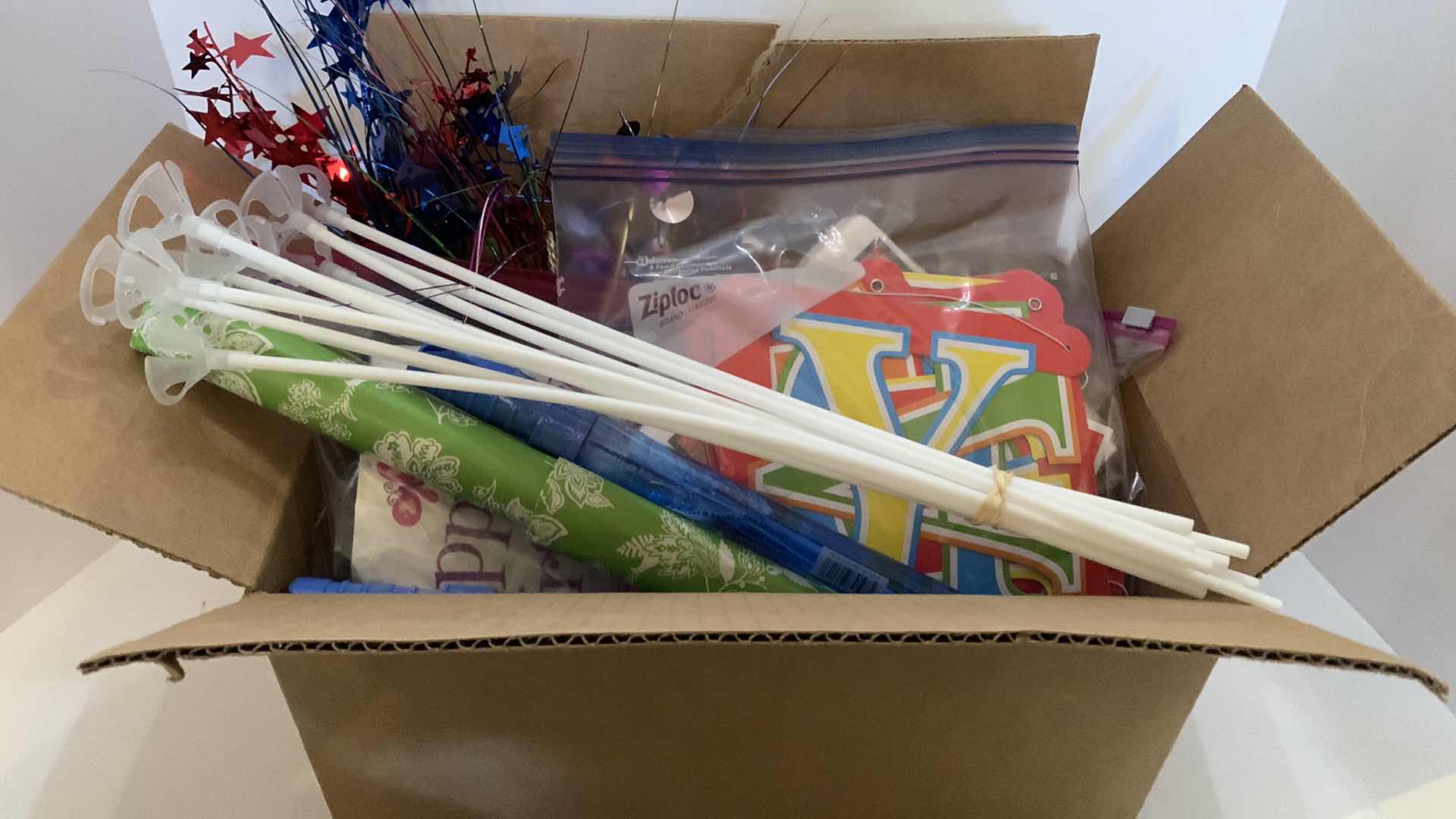 Photo 1 of BOX OF PARTY SUPPLIES