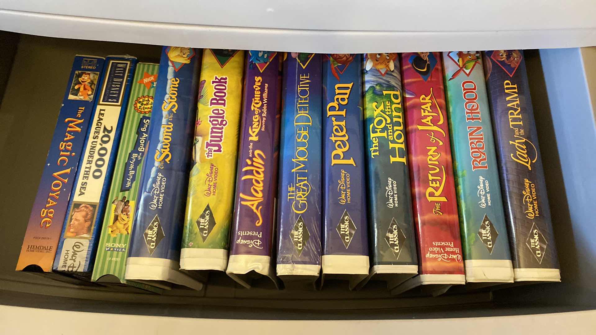 Photo 1 of 4 DRAWER STORAGE WITH DISNEY AND ASSORTED VHS AND DVDS 26 X 18 H36