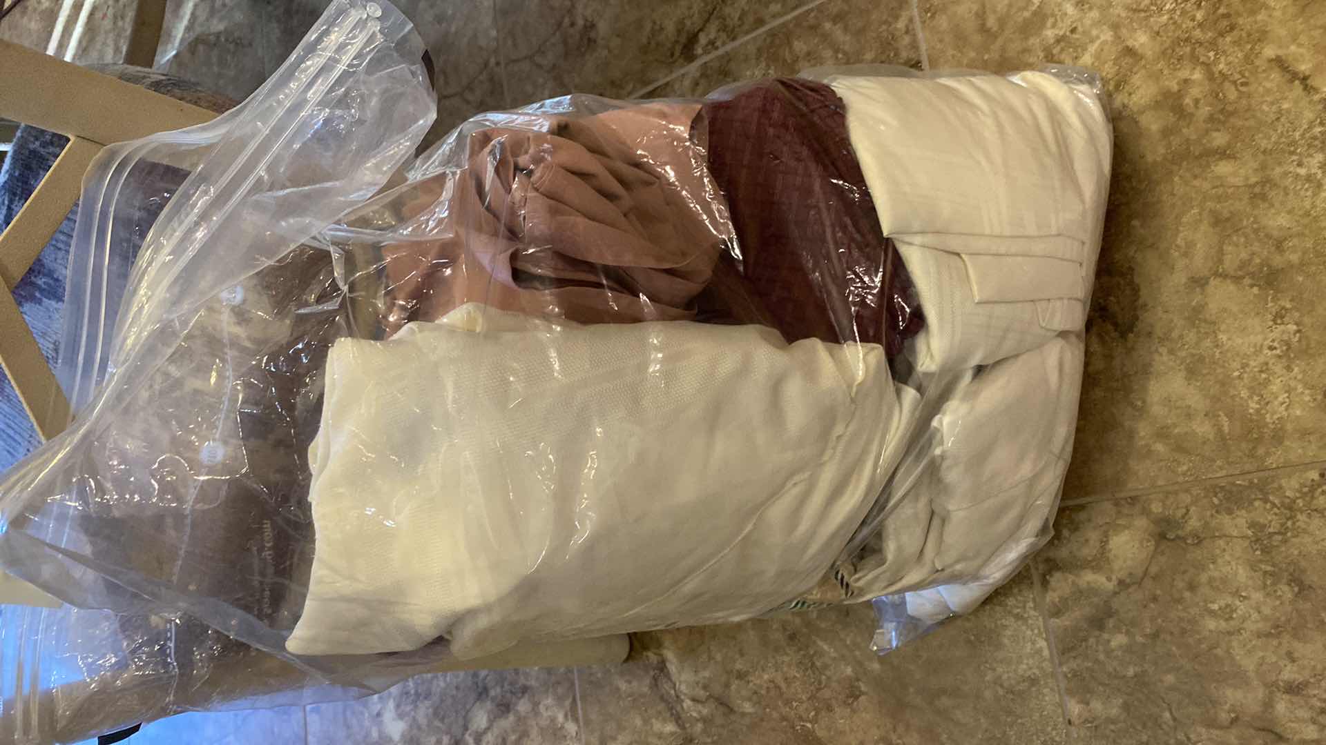 Photo 1 of BAG OF ASSORTED OVAL TABLECLOTHS