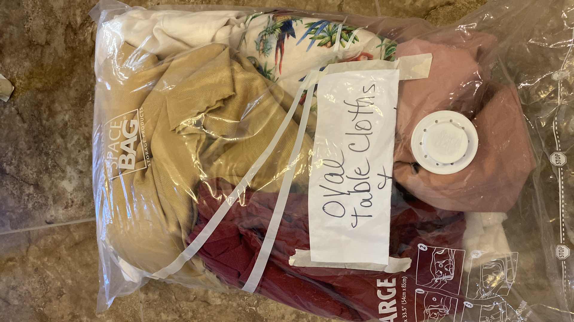 Photo 1 of BAG OF ASSORTED OVAL TABLECLOTHS