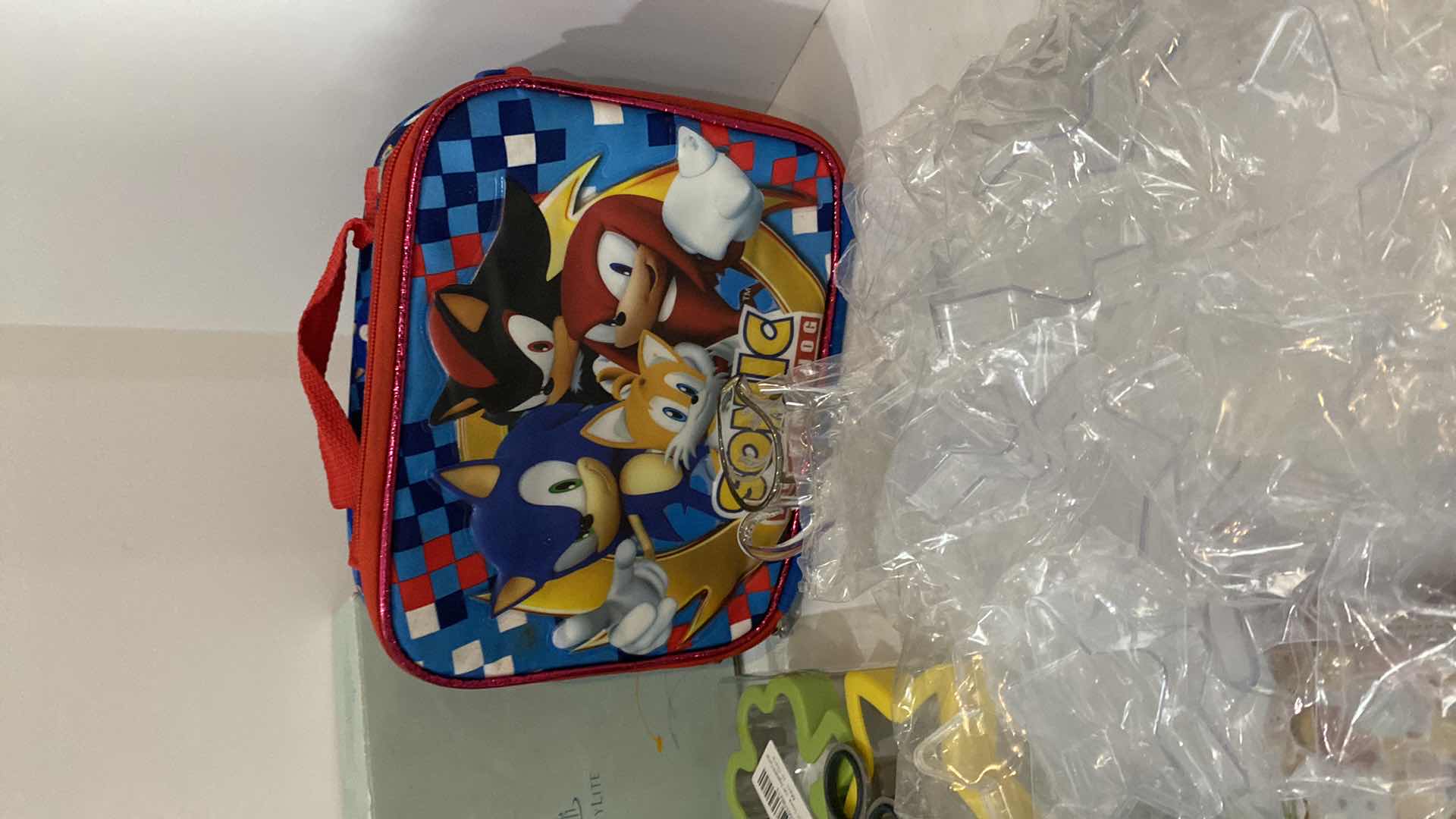 Photo 1 of ASSORTMENT OF HOUSEHOLD ITEMS ACRYLIC STARS, LUNCH BAGS, COOKIE CUTTERS AND MORE