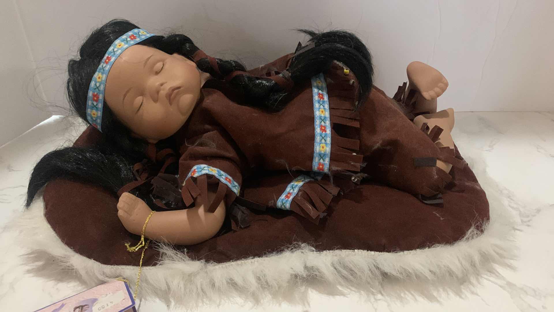 Photo 1 of COLLECTIBLE PORCELAIN INDIAN BABY DOLL w COA 12”