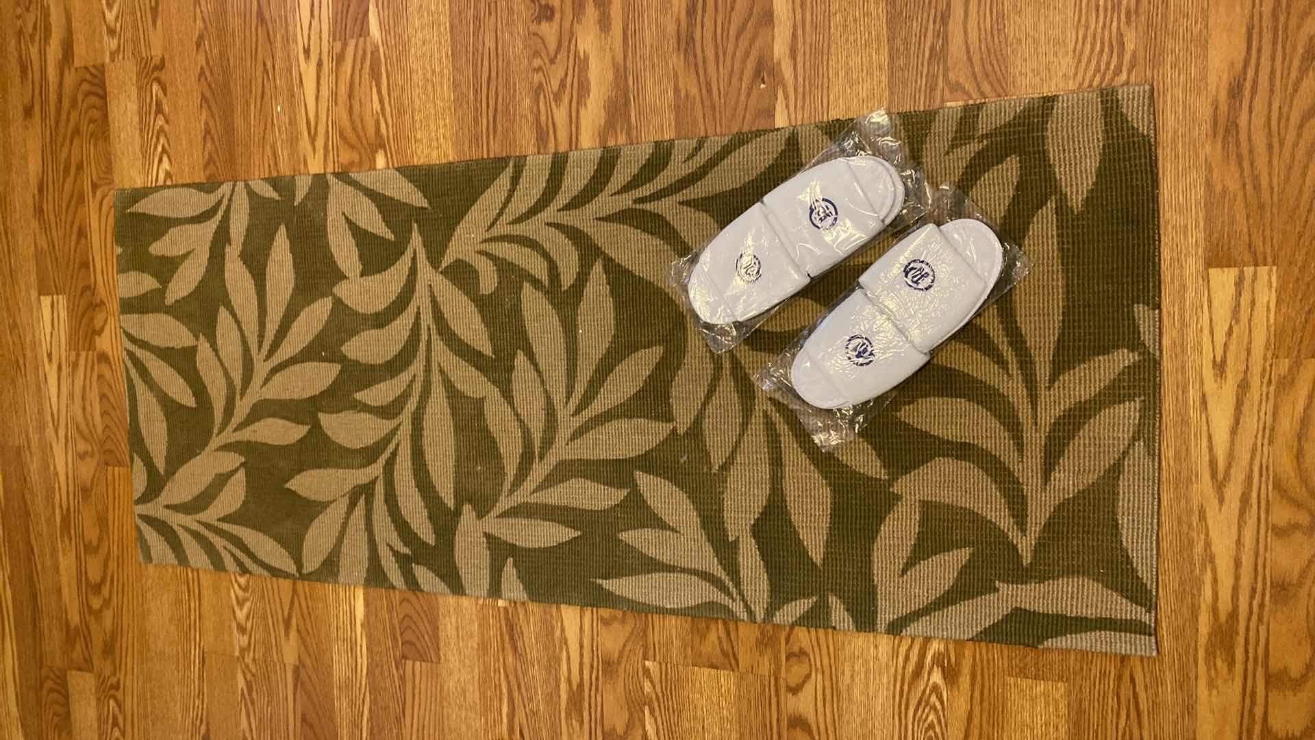 Photo 1 of CUSHIONED RUG 5’ X 2’ AND NEW SLIPPERS