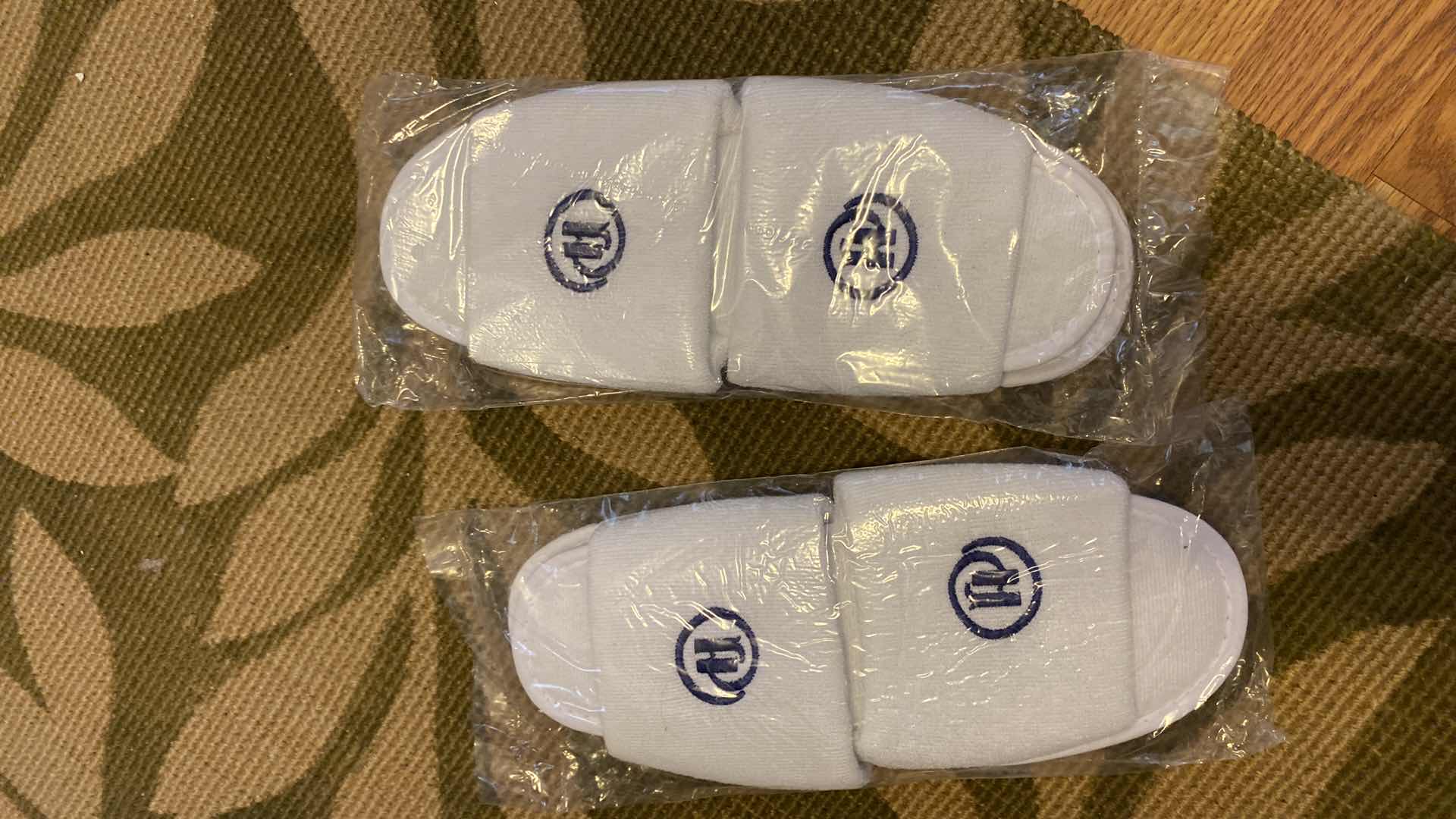 Photo 1 of CUSHIONED RUG 5’ X 2’ AND NEW SLIPPERS