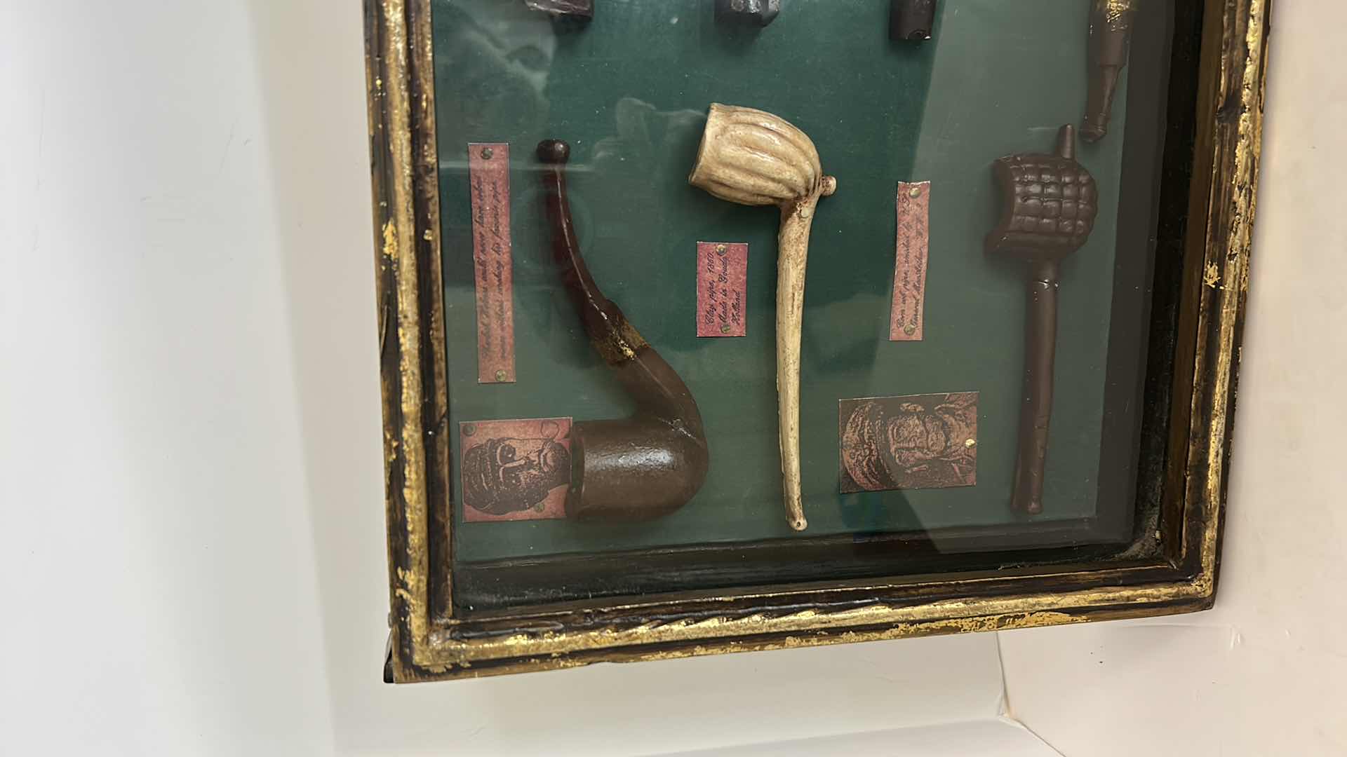 Photo 3 of DISTRESSED BLACK AND GOLD FRAMED SHADOW BOX WITH VINTAGE PIPES 20.5” x 11.25”