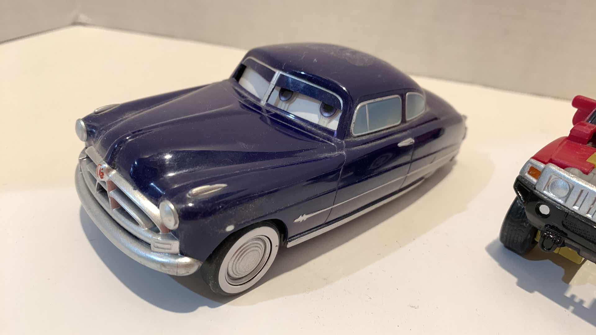 Photo 1 of 2 COLLECTABLE CAR TOYS ONE IS TRANSFORMER