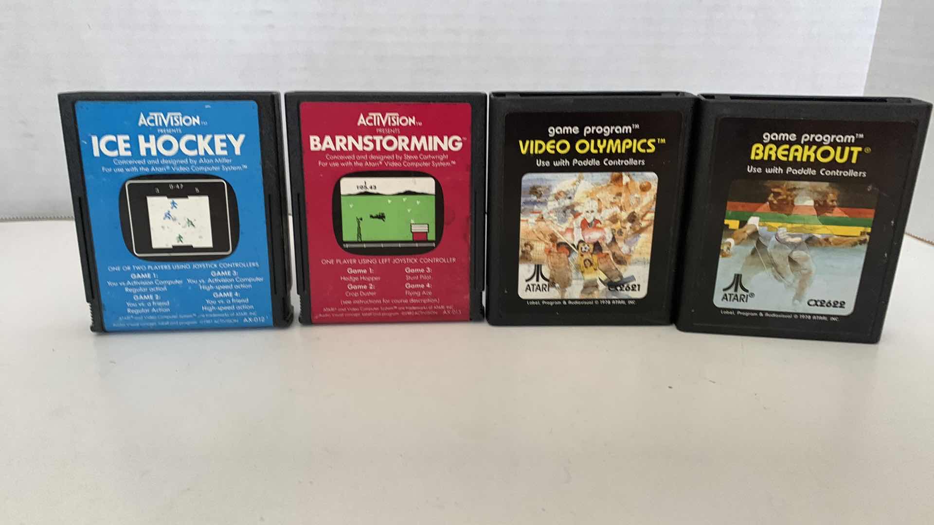 Photo 1 of 4 PCS VINTAGE ATARI 2600 GAMES: ICE HOCKEY, BARNSTORMING,VIDEO OLYMPICS, AND BREAKOUT