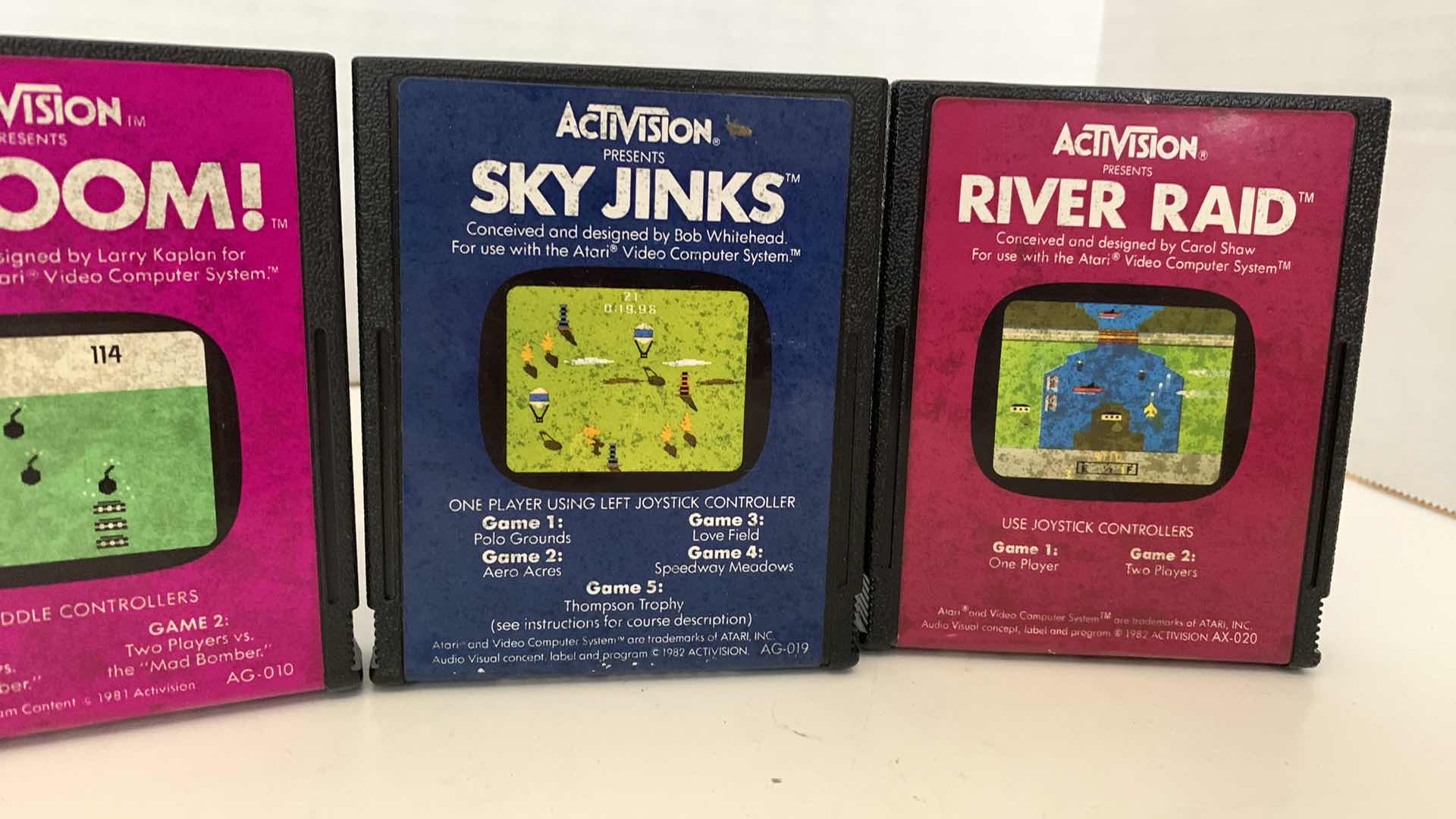 Photo 1 of 4 PCS VINTAGE ATARI 2600 GAMES:BARNSTORMING,KABOOM,SKY JINKS, AND RIVER RAID