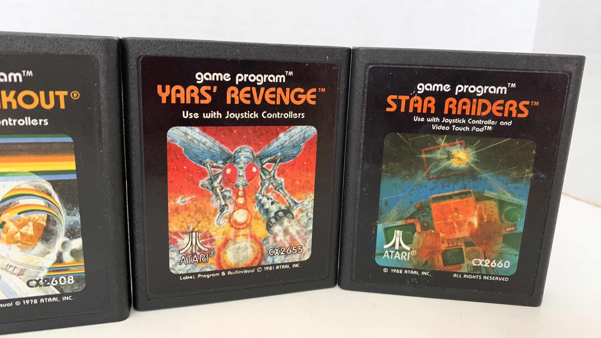 Photo 1 of 4 PCS VINTAGE ATARI 2600 GAMES:BERZERK,SUPER BREAKOUIT,YAR'S REVENGE, AND STAR RAIDERS