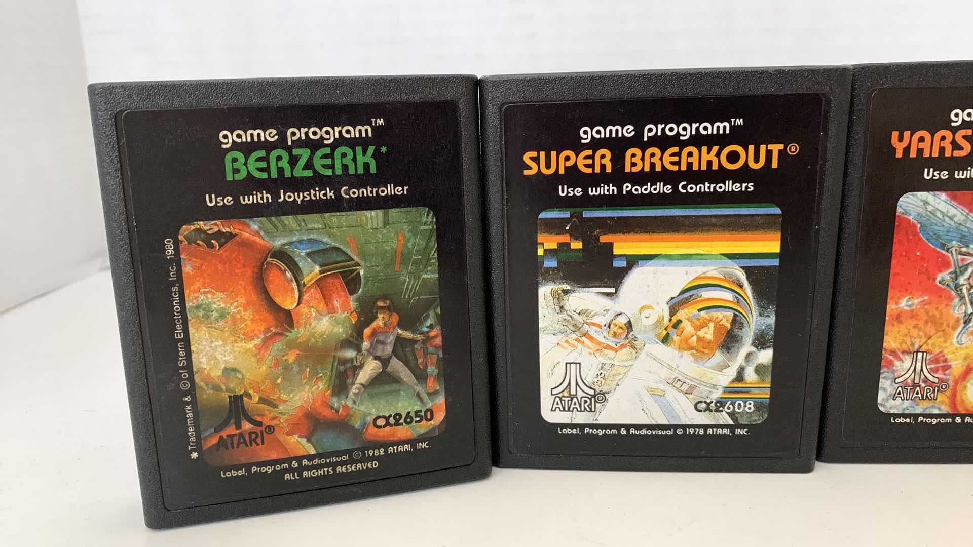 Photo 1 of 4 PCS VINTAGE ATARI 2600 GAMES:BERZERK,SUPER BREAKOUIT,YAR'S REVENGE, AND STAR RAIDERS
