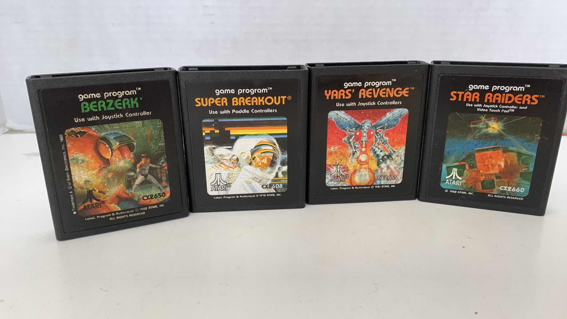 Photo 1 of 4 PCS VINTAGE ATARI 2600 GAMES:BERZERK,SUPER BREAKOUIT,YAR'S REVENGE, AND STAR RAIDERS
