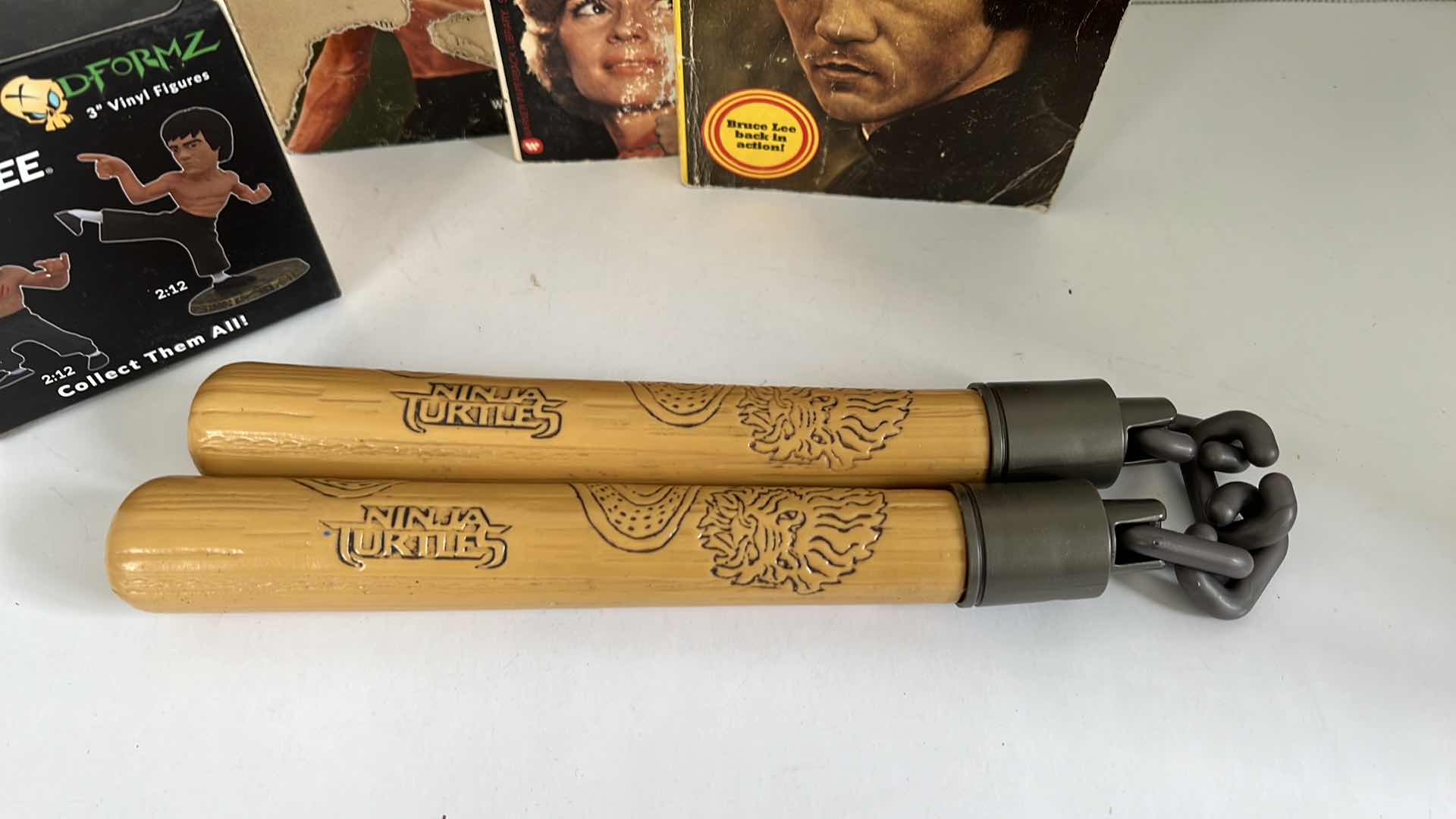 Photo 1 of BRUCE LEE COLLECTIBLES BOOKS VINYL FIGURES NUNCHUCKS