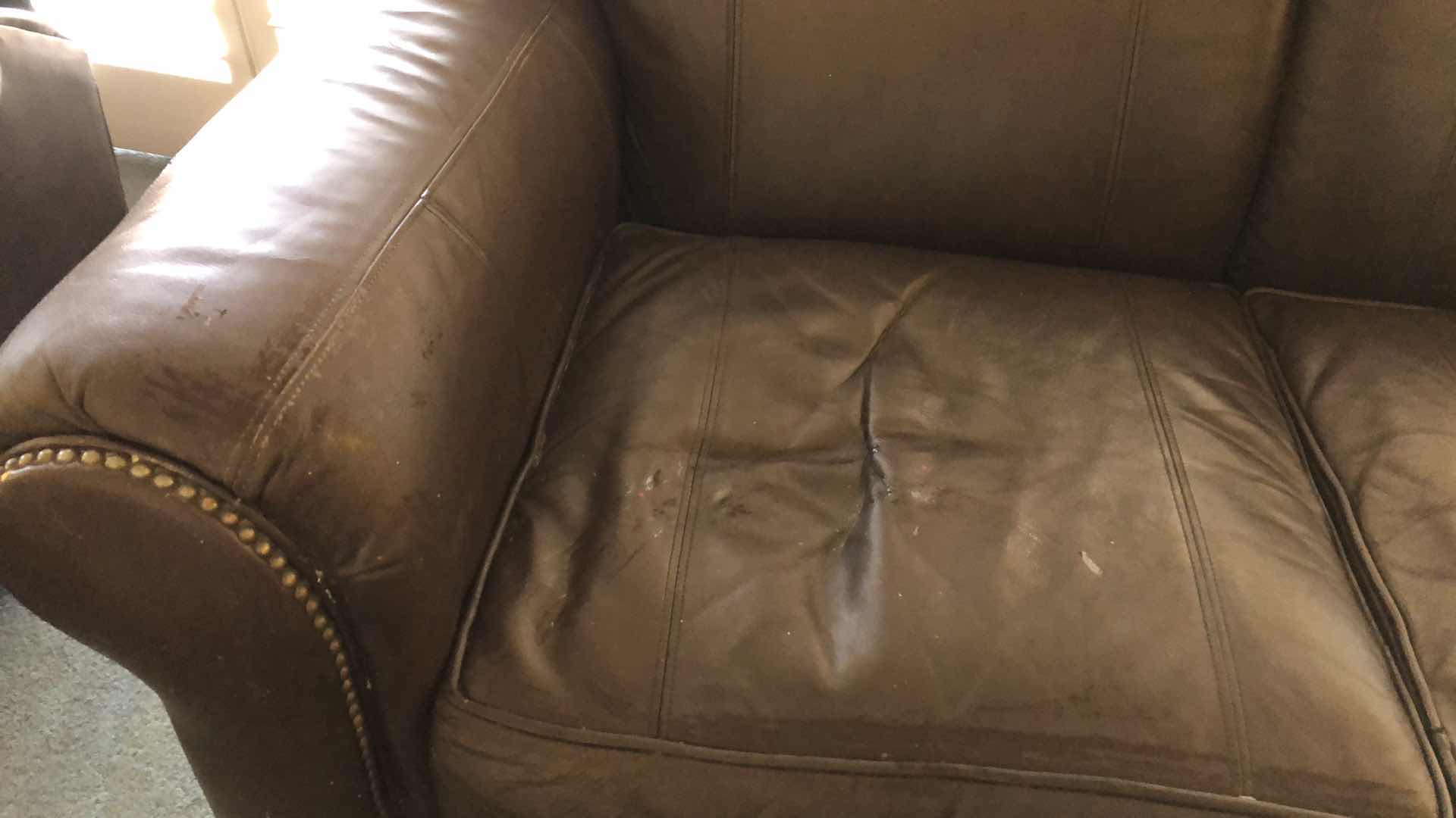 Photo 1 of LEATHER NAIL HEAD LOVE SEAT 63” X 38” H 36”