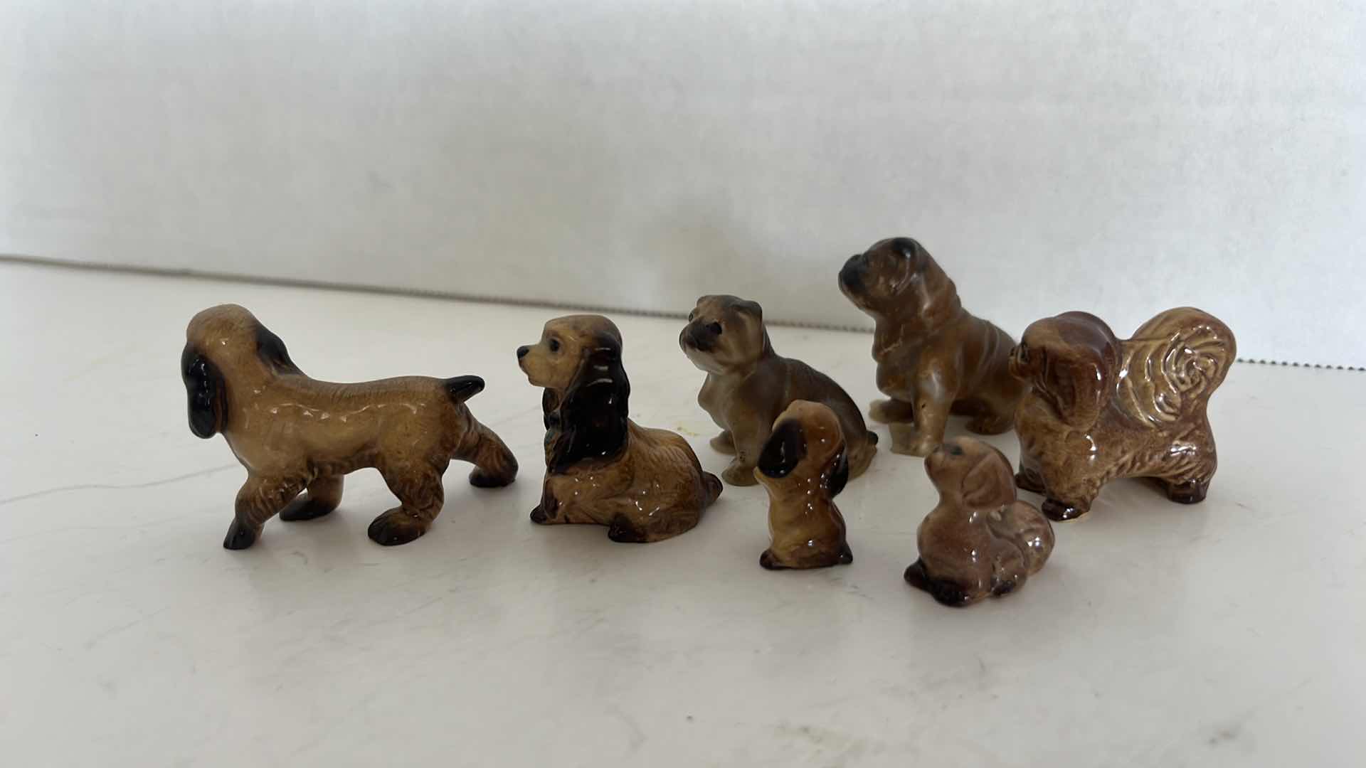 Photo 1 of 7-MINIATURE VINTAGE DOG FIGURINES (1/2” TO 1”)