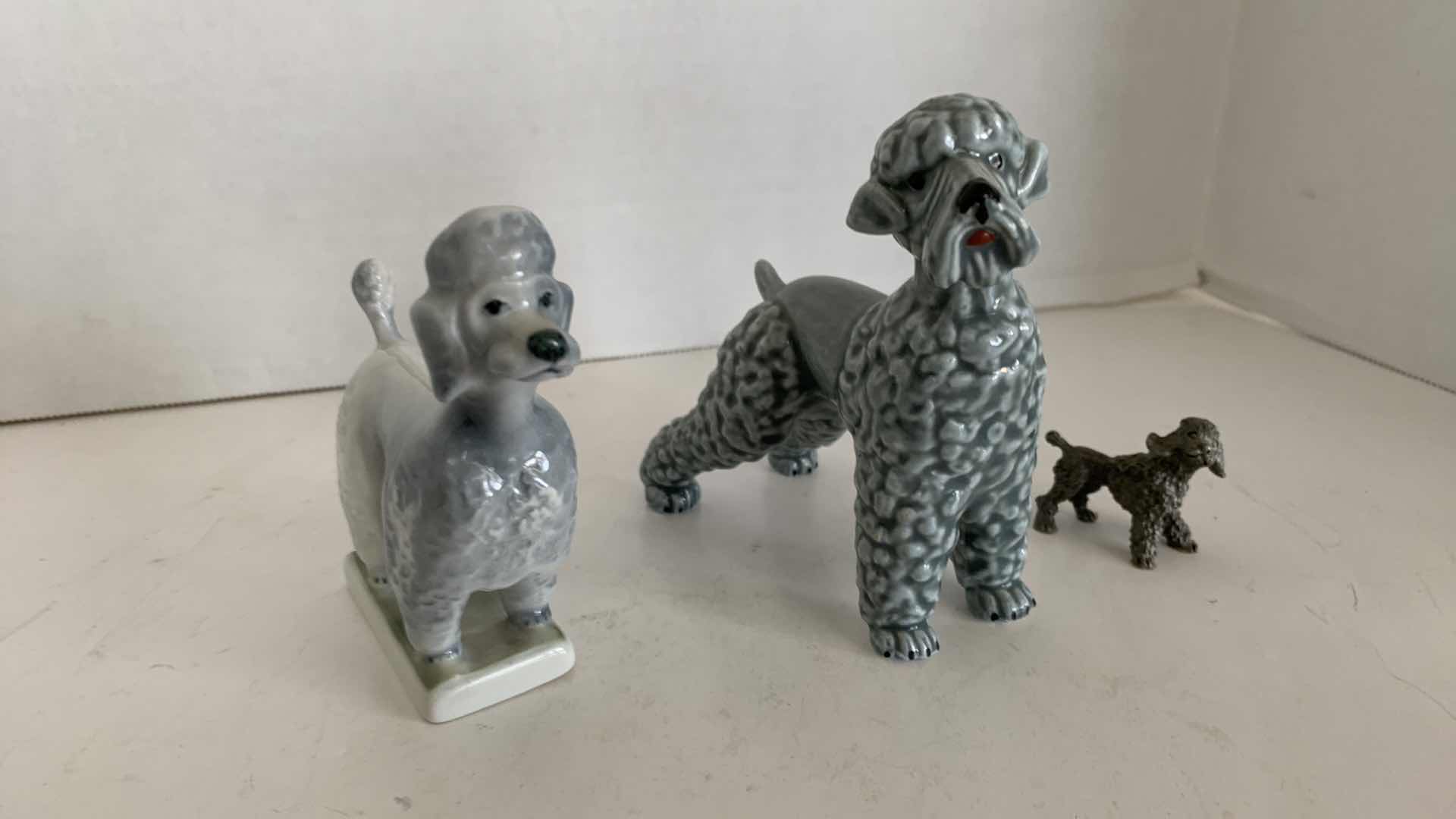 Photo 1 of 3-POODLE DOG STATUES TALLEST IS 4.5”