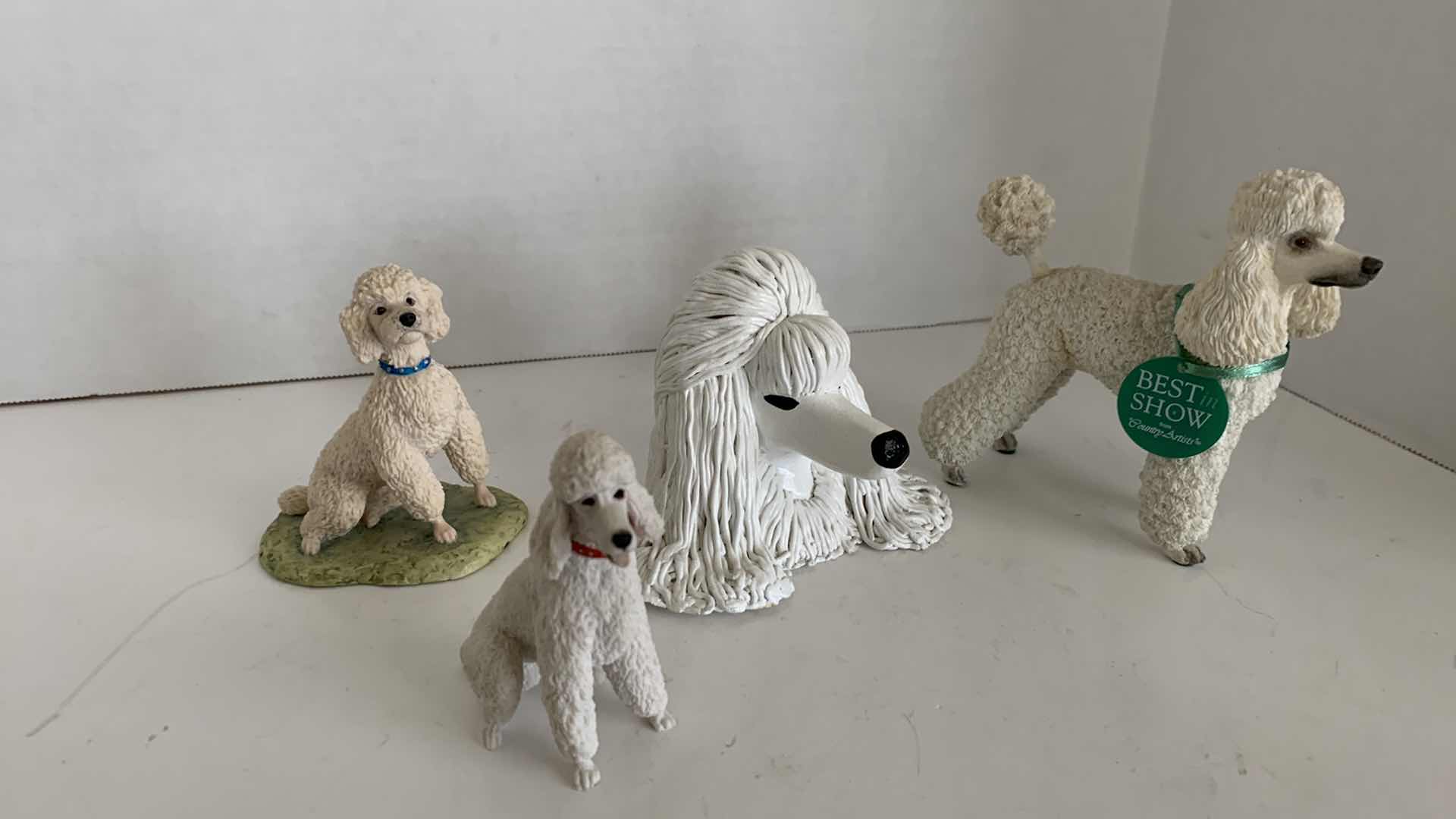 Photo 1 of 4-POODLE STATUES TALLEST IS 5”