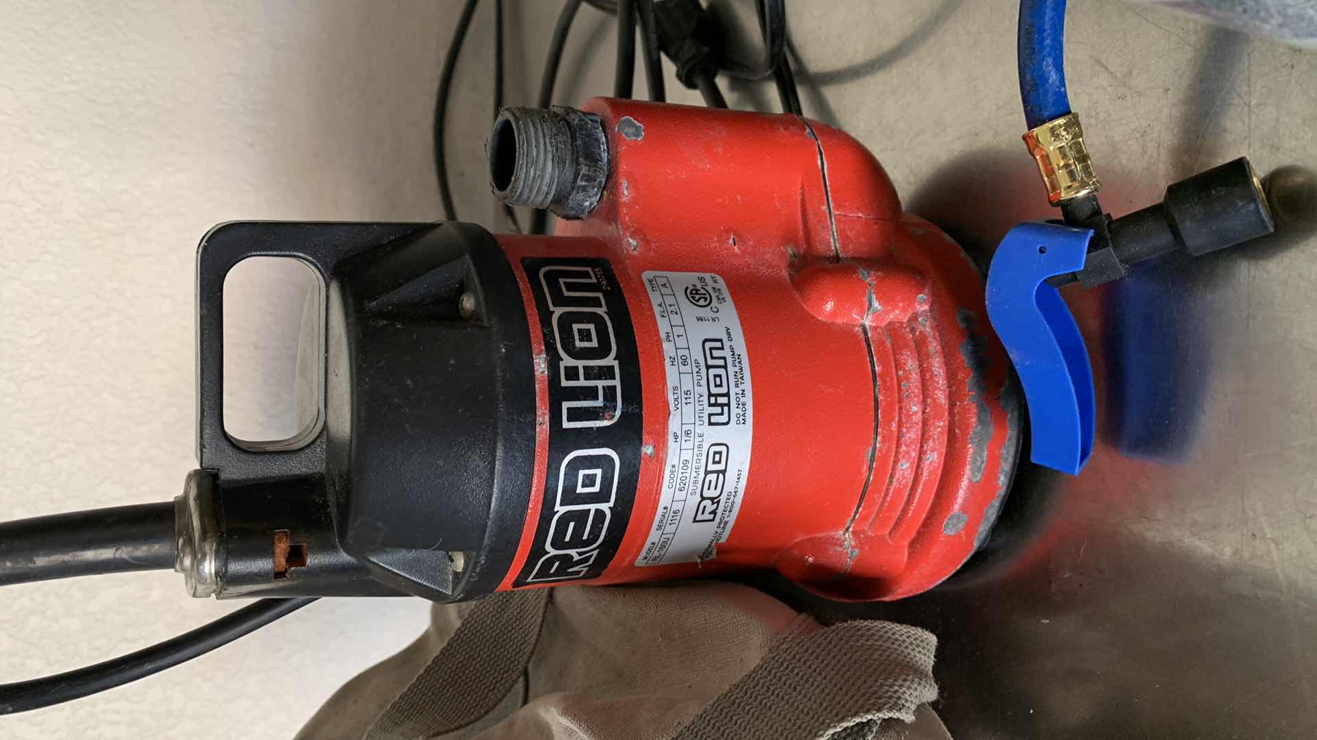 Photo 3 of GARAGE TOOLS AND ASSORTED ITEMS. CROW BAR, UTILITY PUMP, FAN AND NAILS.