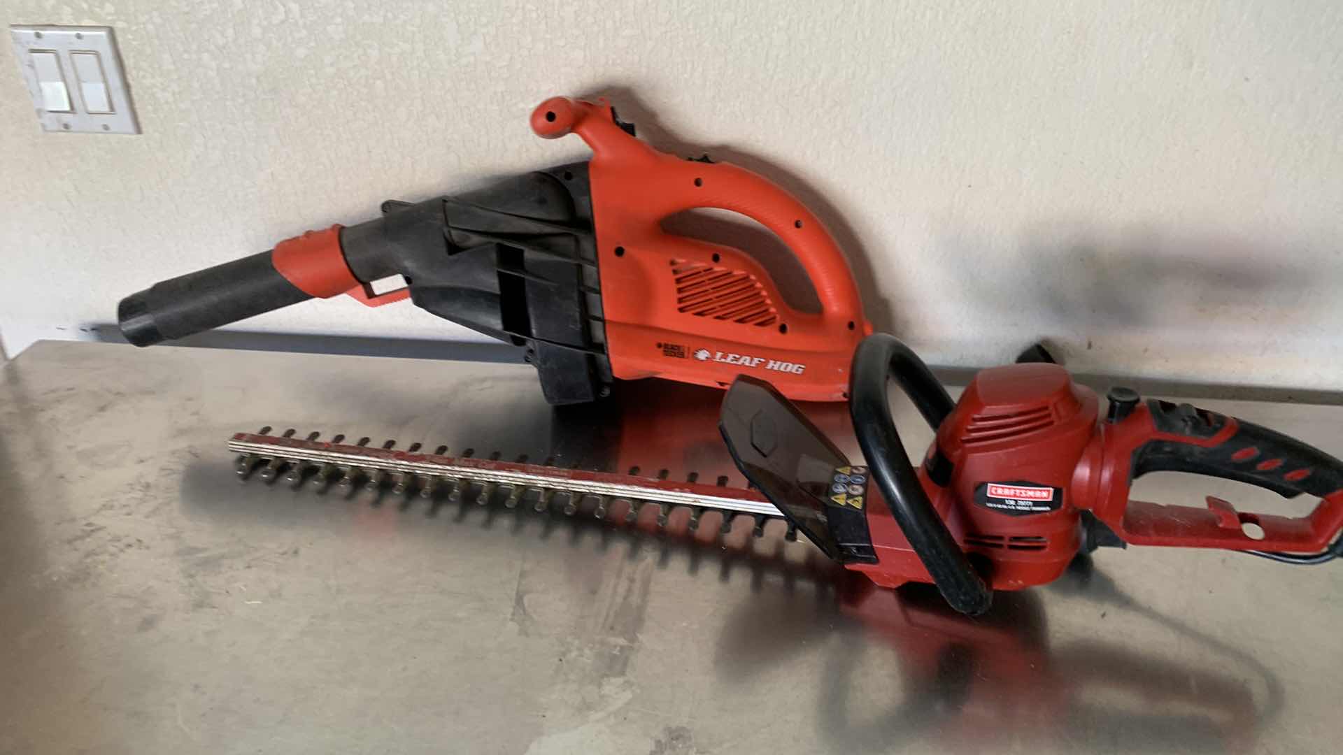Photo 1 of BLACK AND DECKER LEAF BLOWER AND AN ELECTRIC CRAFTSMAN HEDGE TRIMMER