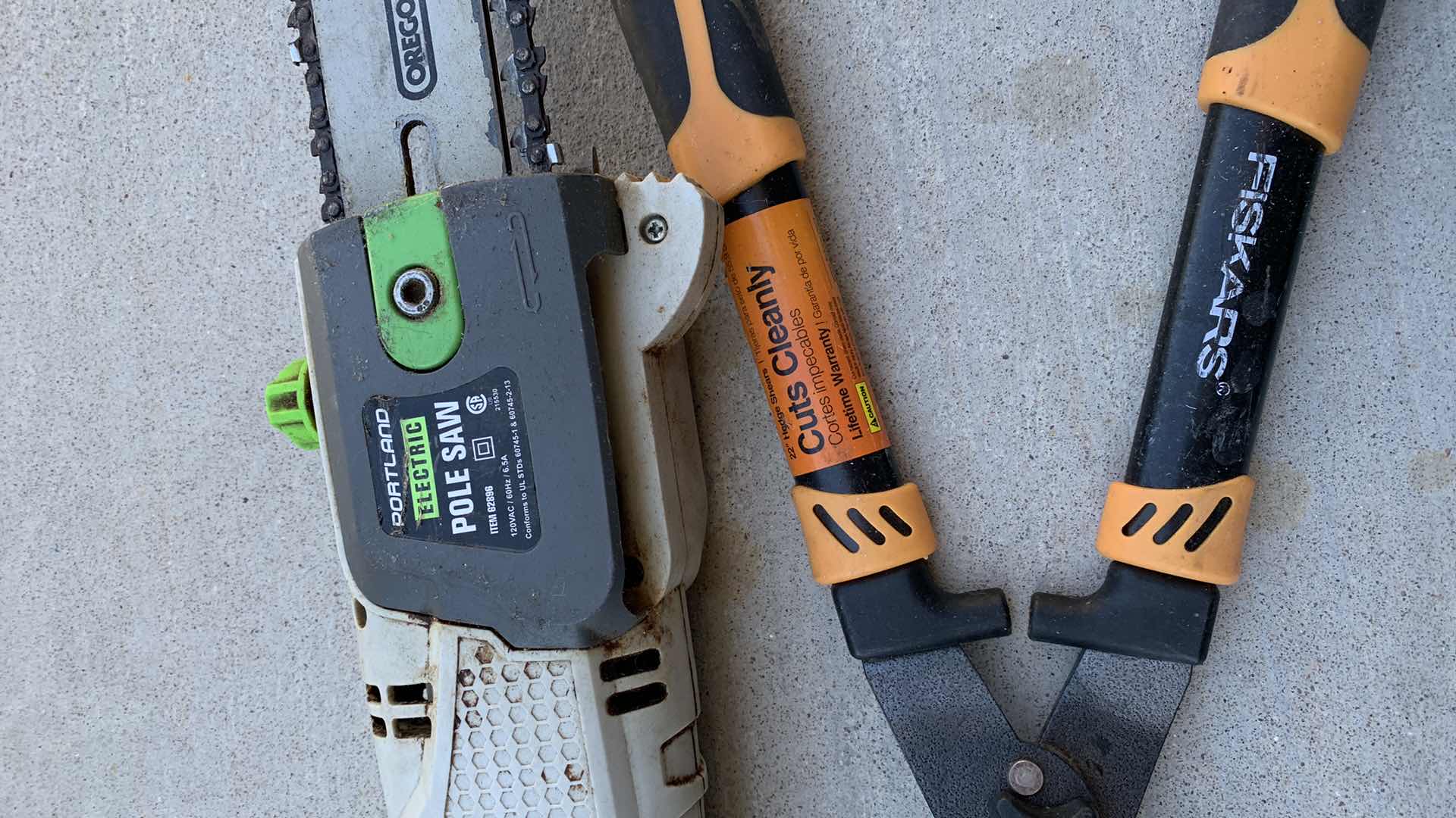 Photo 1 of ASSORTED LAWN AND GARDEN TOOLS. GAS CAN, SHEERS AND ELECTRIC POLE SAW.