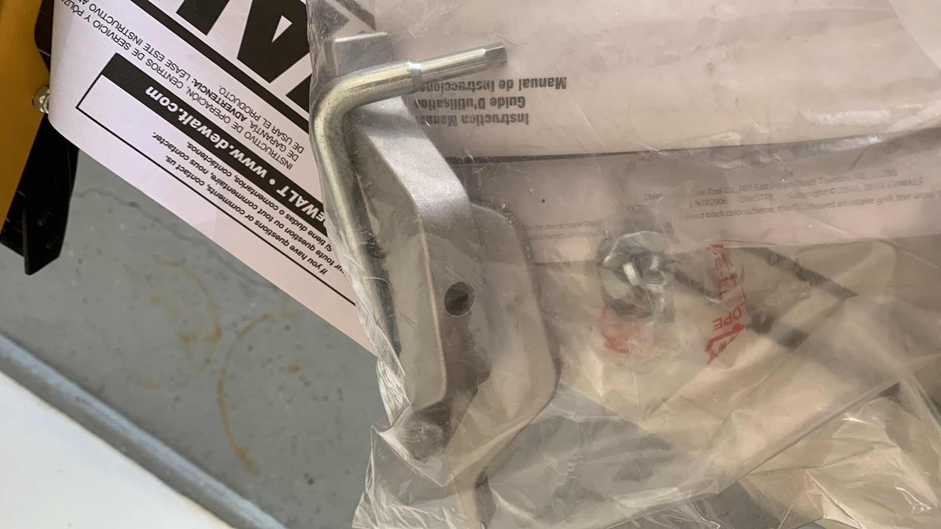 Photo 6 of DEWALT DWS779 12” DOUBLE BEVEL SLIDING COMPOUND MITER SAW AND A DWX723 HEAVY DUTY MITER SAW STAND