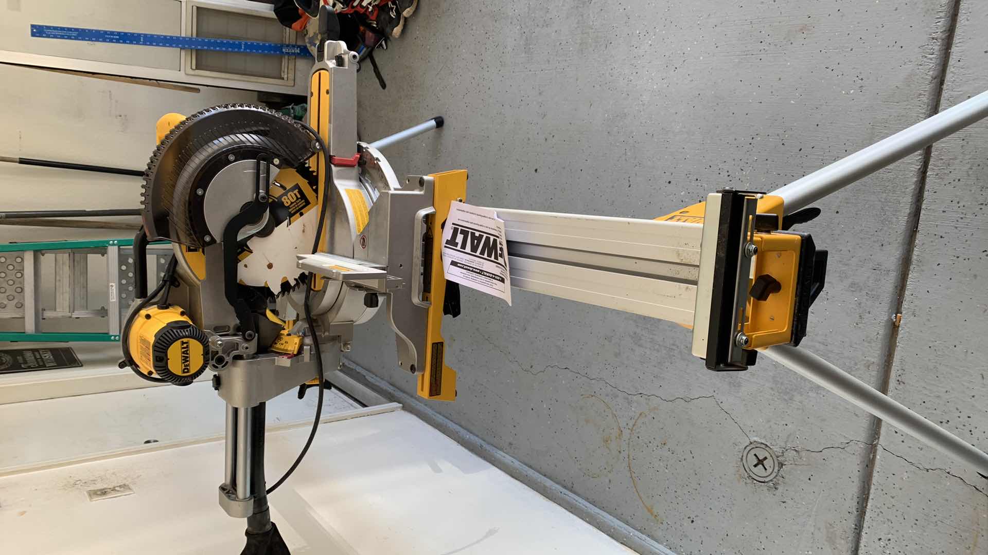 Photo 5 of DEWALT DWS779 12” DOUBLE BEVEL SLIDING COMPOUND MITER SAW AND A DWX723 HEAVY DUTY MITER SAW STAND