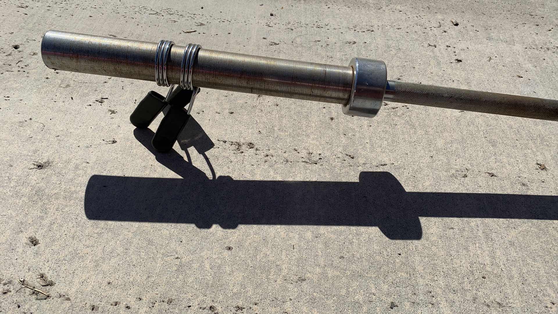 Photo 1 of EXERCISE EQUIPTMENT OLYMPIC BARBELL