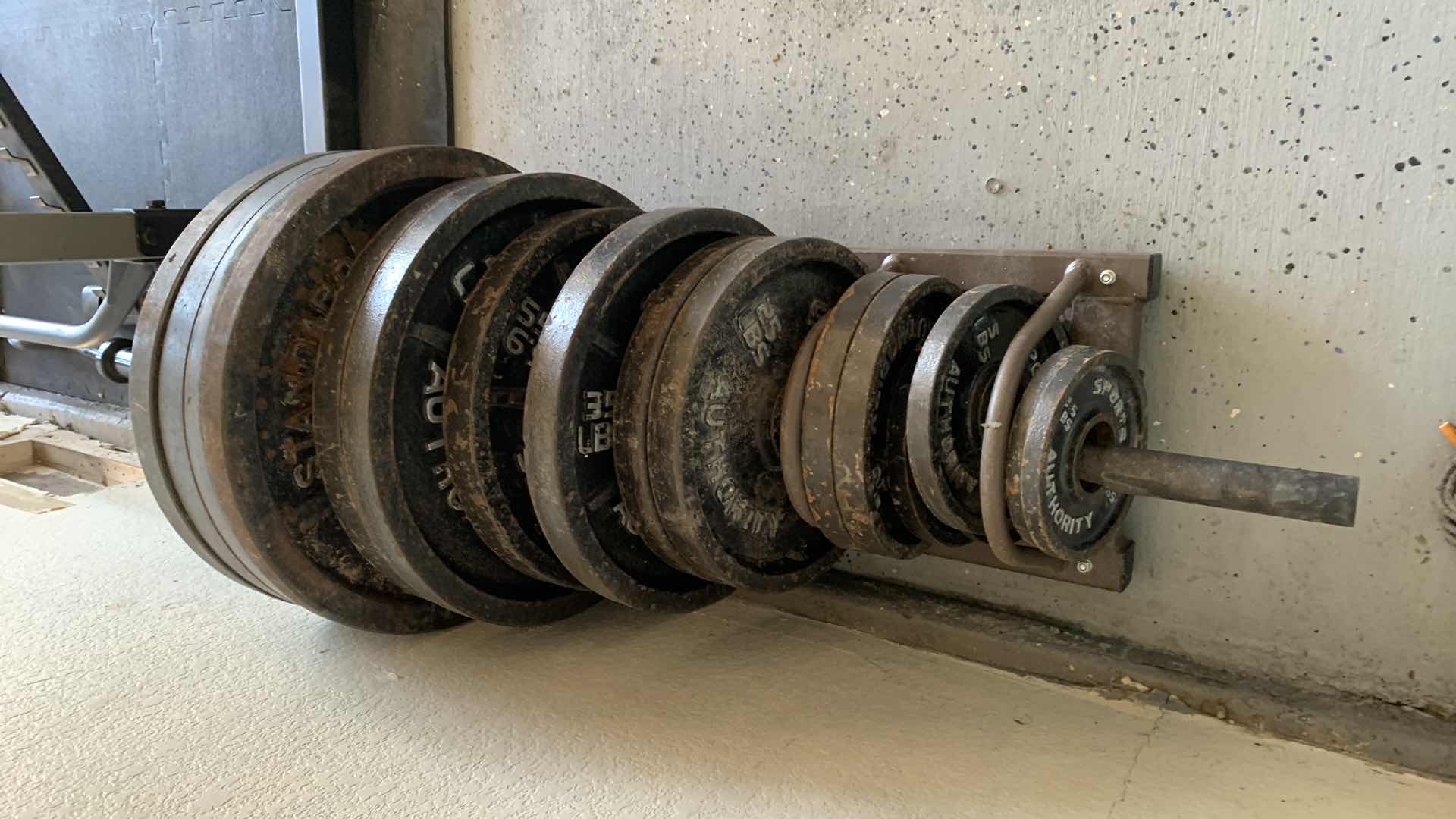 Photo 2 of EXERCISE EQUIPTMENT-OLYMPIC WEIGHT PLATES SET WITH RACK WITH WHEELS
