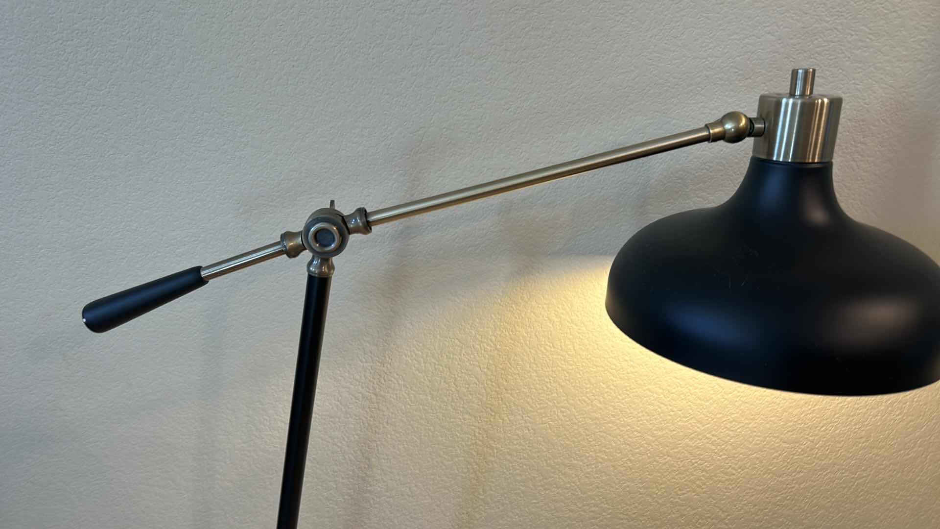 Photo 1 of BRASS AND BLACK METAL ADJUSTABLE FLOOR LAMP  (pictured at 55" high)