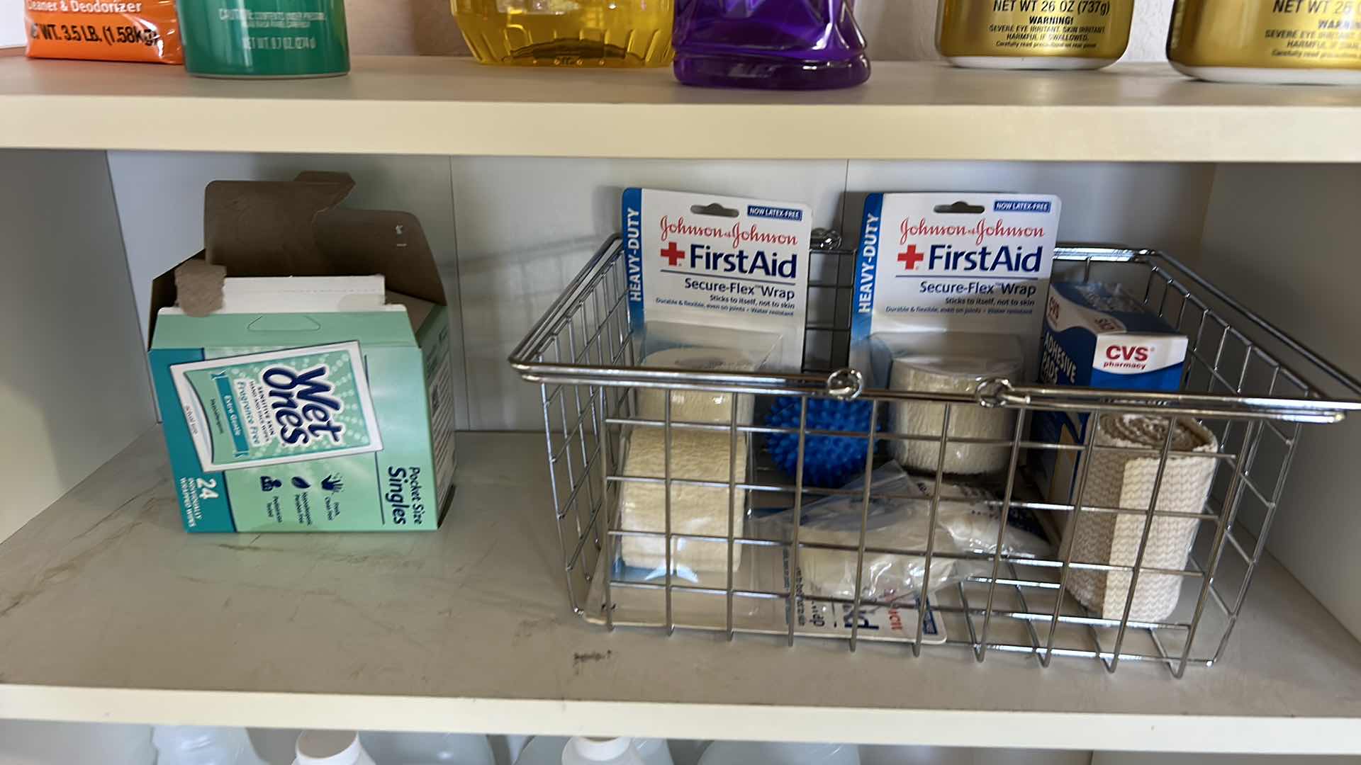 Photo 3 of BOOKSHELF W CLEANING AND FIRST AID SUPPLIES