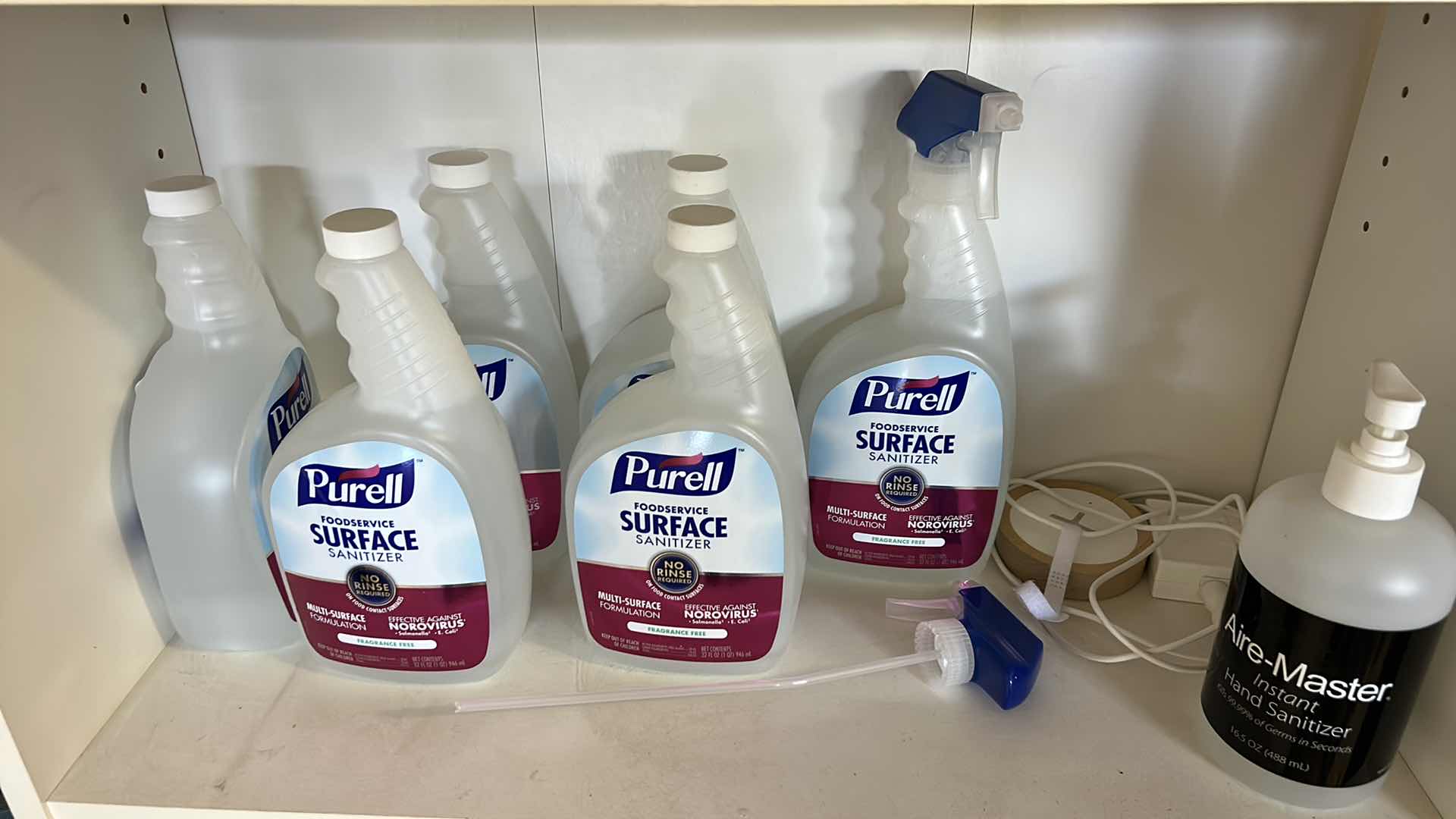 Photo 1 of BOOKSHELF W CLEANING AND FIRST AID SUPPLIES