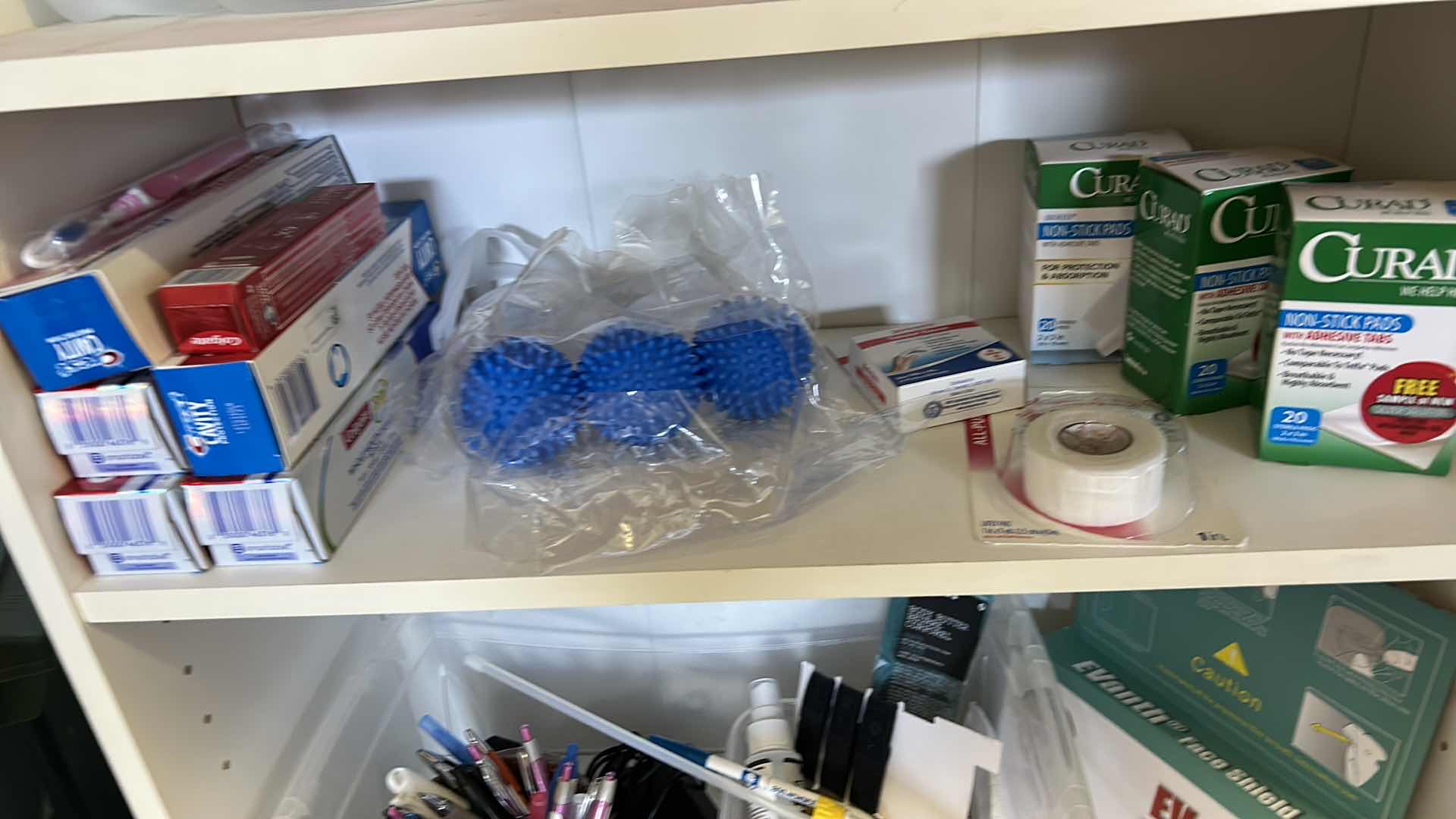 Photo 5 of BOOKSHELF W CLEANING AND FIRST AID SUPPLIES