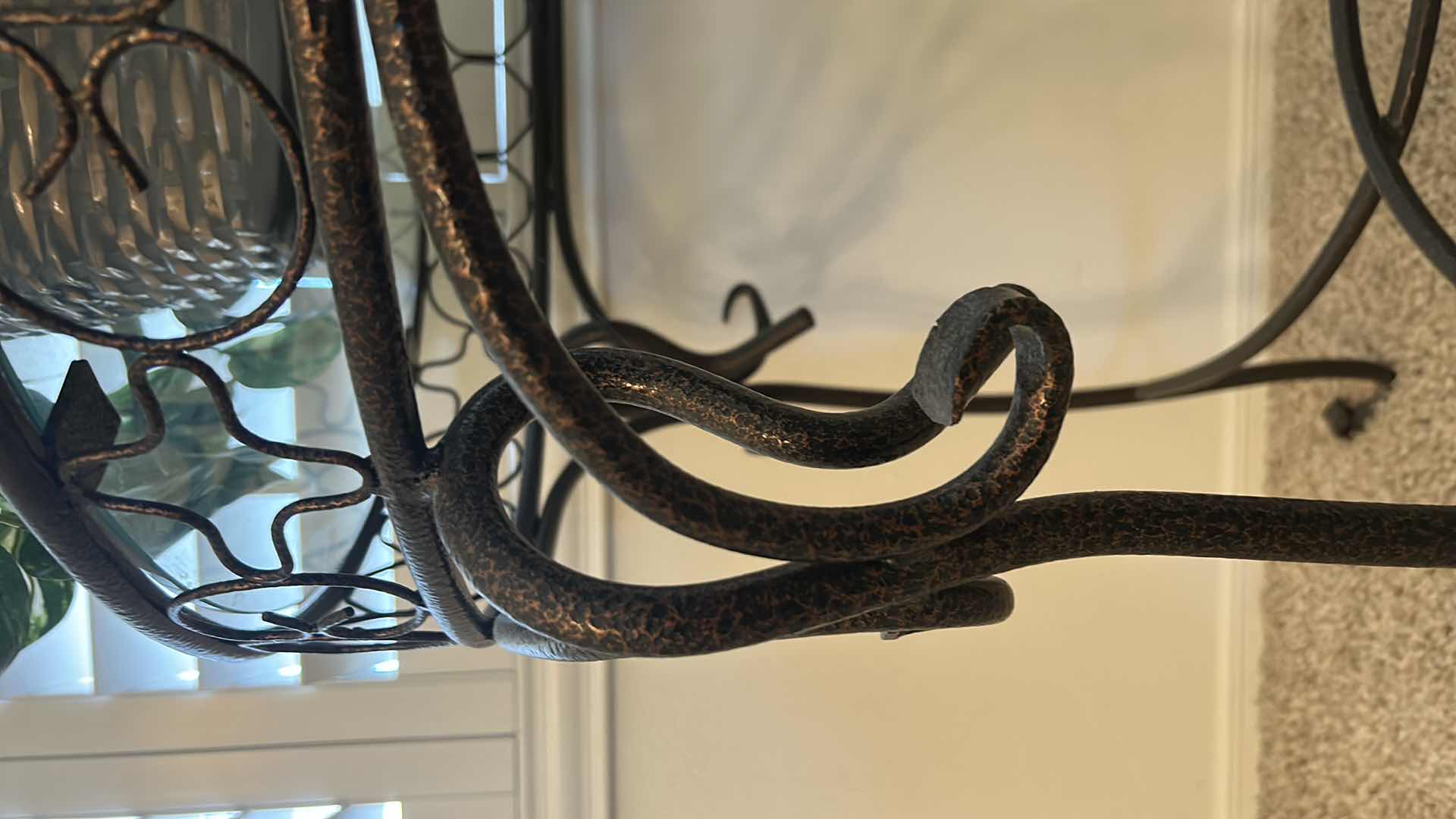 Photo 1 of BLACK AND GOLD WROUGHT IRON GLASS TOP TABLE WITH FAUX PLANT 26” x 28 1/2”