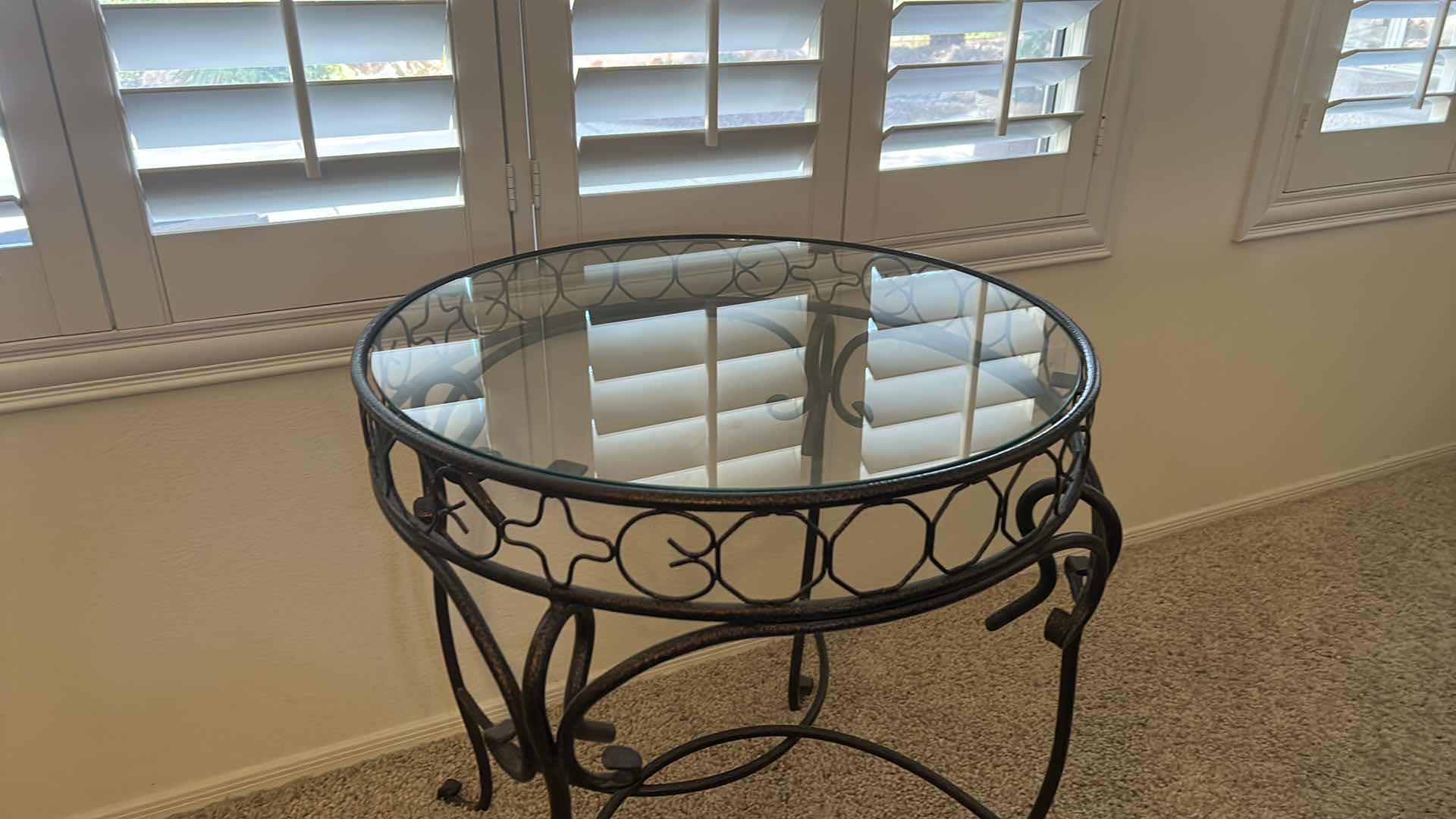 Photo 1 of BLACK AND GOLD WROUGHT IRON GLASS TOP TABLE WITH FAUX PLANT 26” x 28 1/2”