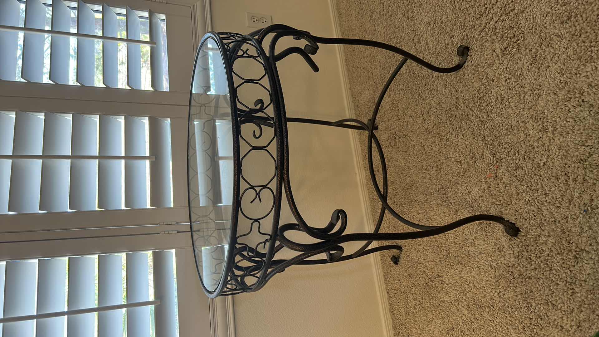 Photo 1 of BLACK AND GOLD WROUGHT IRON GLASS TOP TABLE WITH FAUX PLANT 26” x 28 1/2”