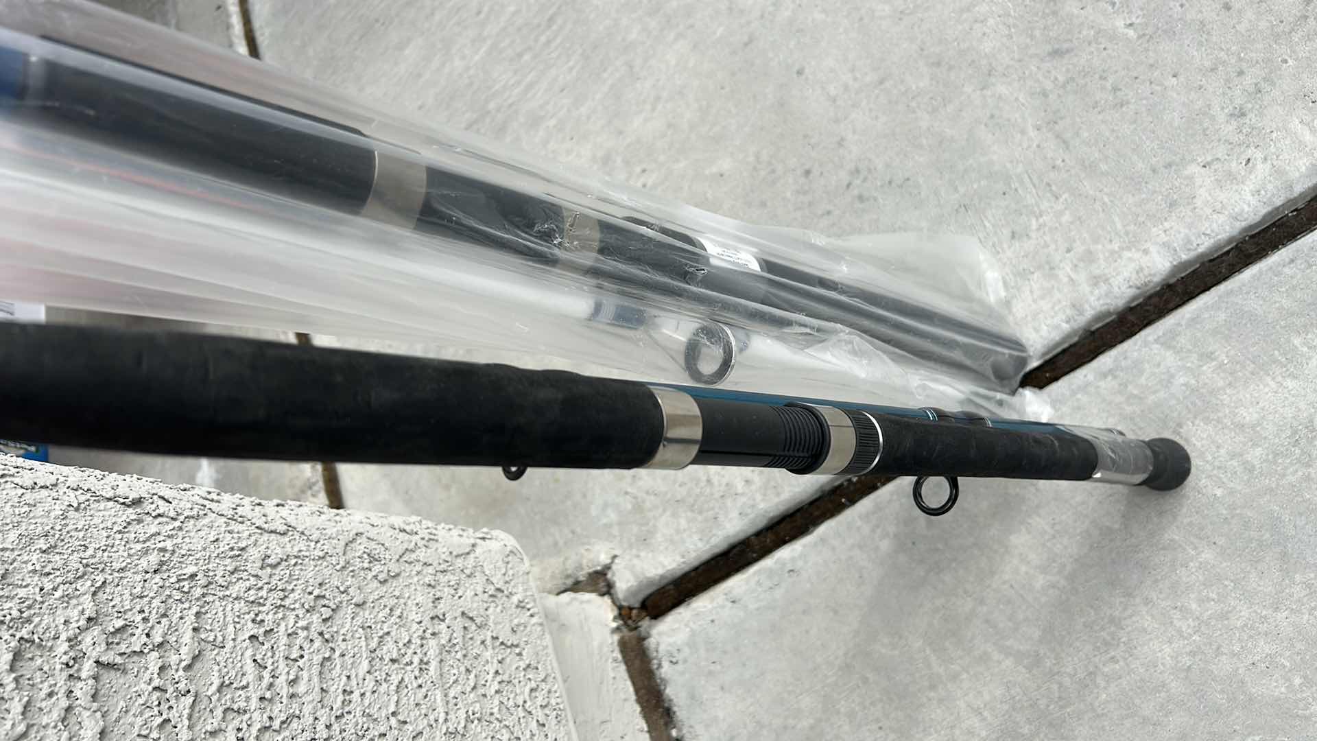 Photo 1 of 2 NEW FISHING POLES