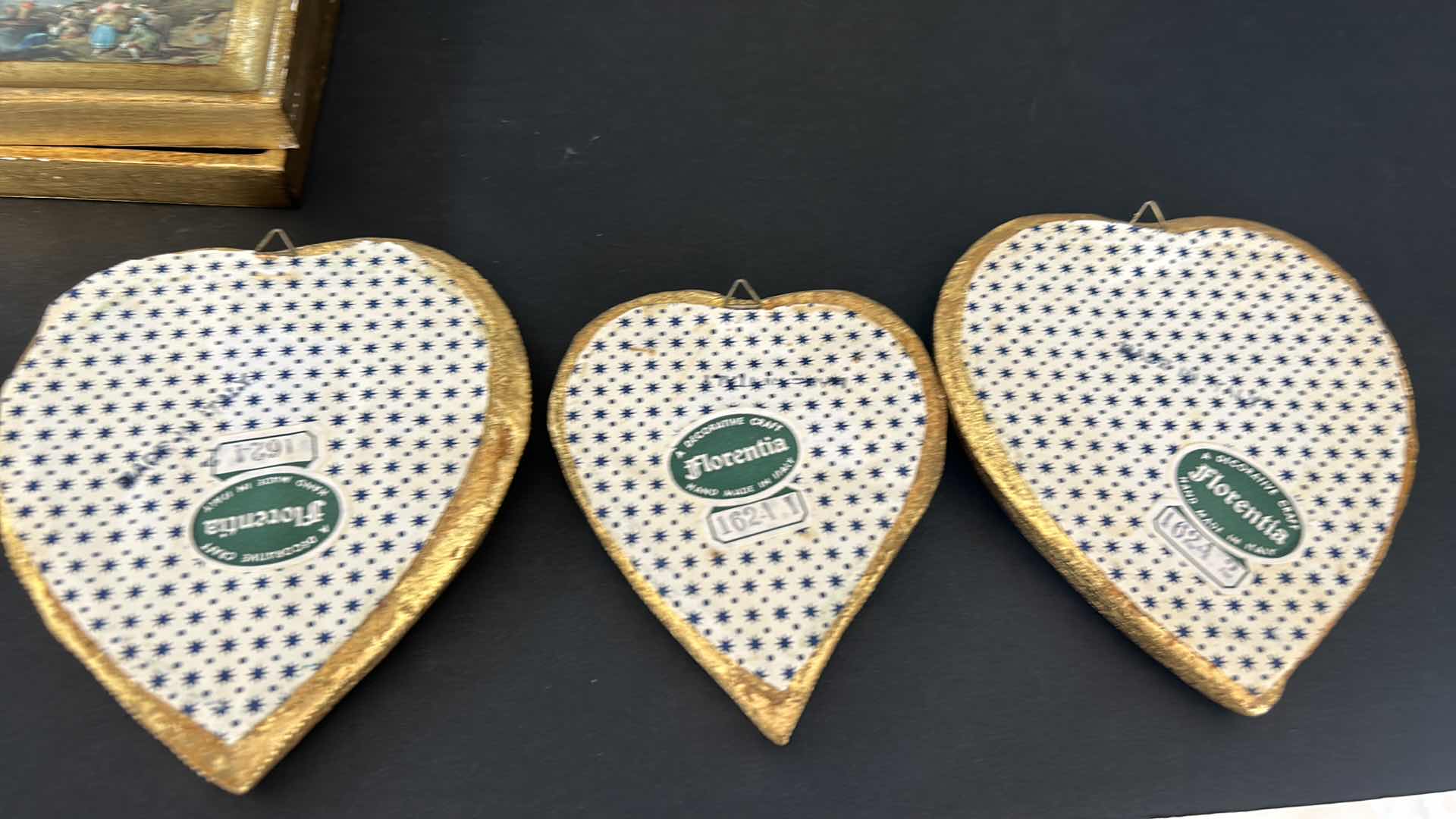 Photo 1 of HOME DECOR ASSORTMENT, NEEDLE POINT PEACOCK 12.5” x 12.5” ITALIAN ARTWORK IN GOLD FRAMES AND 3 ITALIAN GOLD FRAMED HEART MIRRORS