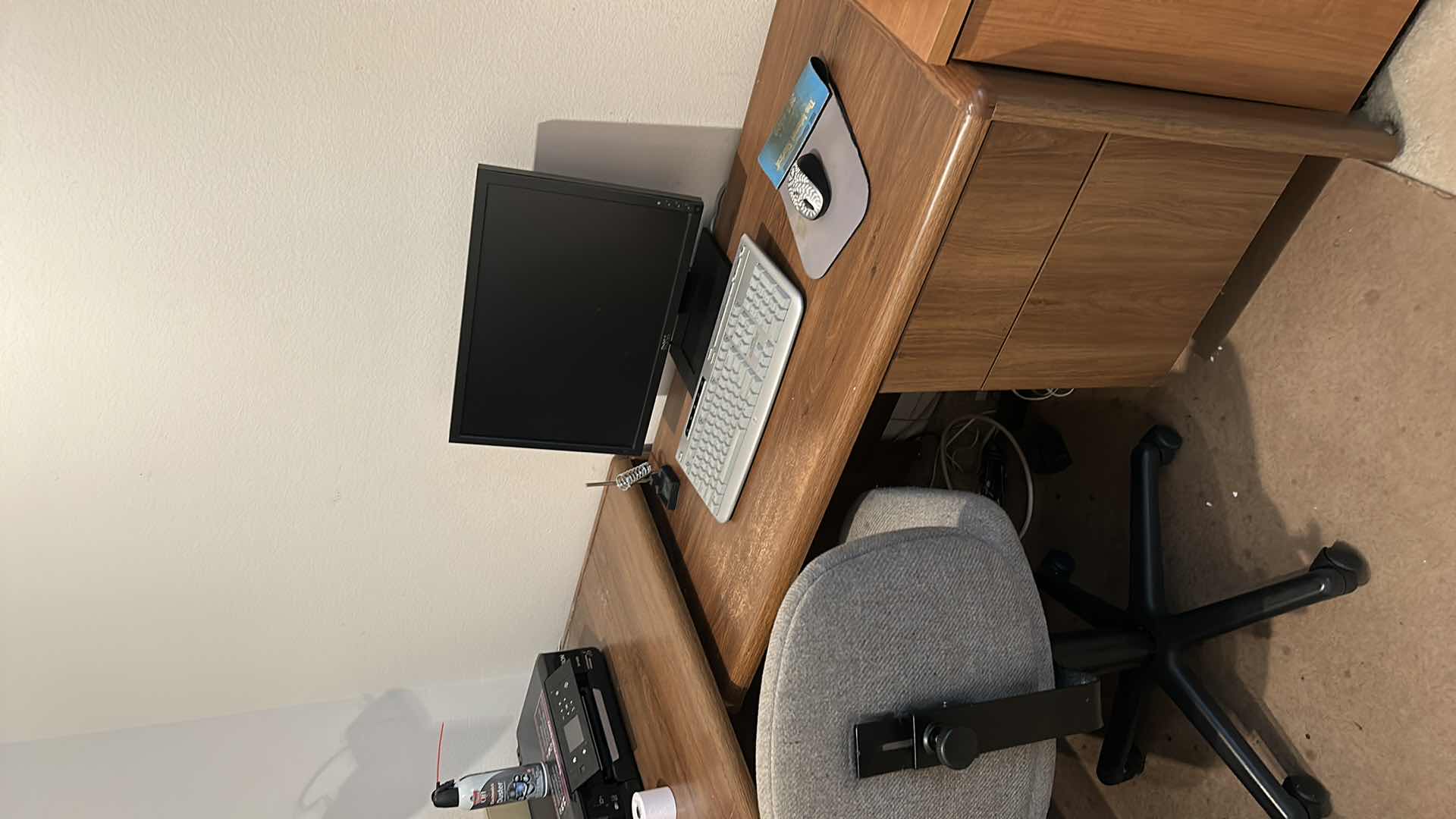 Photo 1 of CORNER DESK UNIT, OFFICE CHAIR, MONITOR, KEYBOARD, SHREDDER, BOOKS AND ACCESSORIES ( DESK 62” x 29 1/2” RETURN 41” x 21”